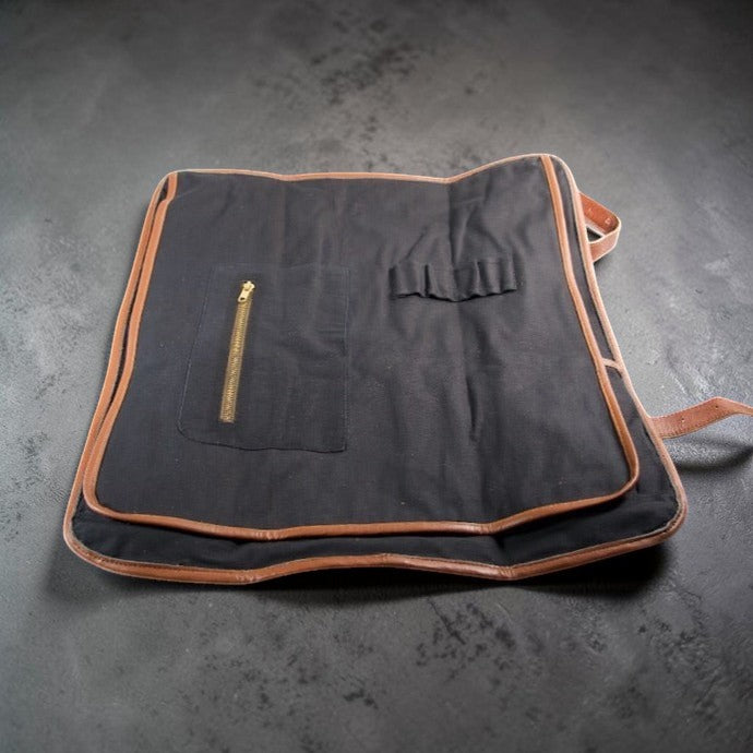 Canvas knife roll by Tokushu Knife showing flap that protects knives.