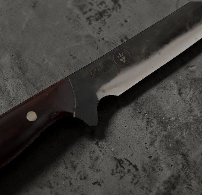 Close up of Dao Vua logo on their file knife with a rosewood handlee
