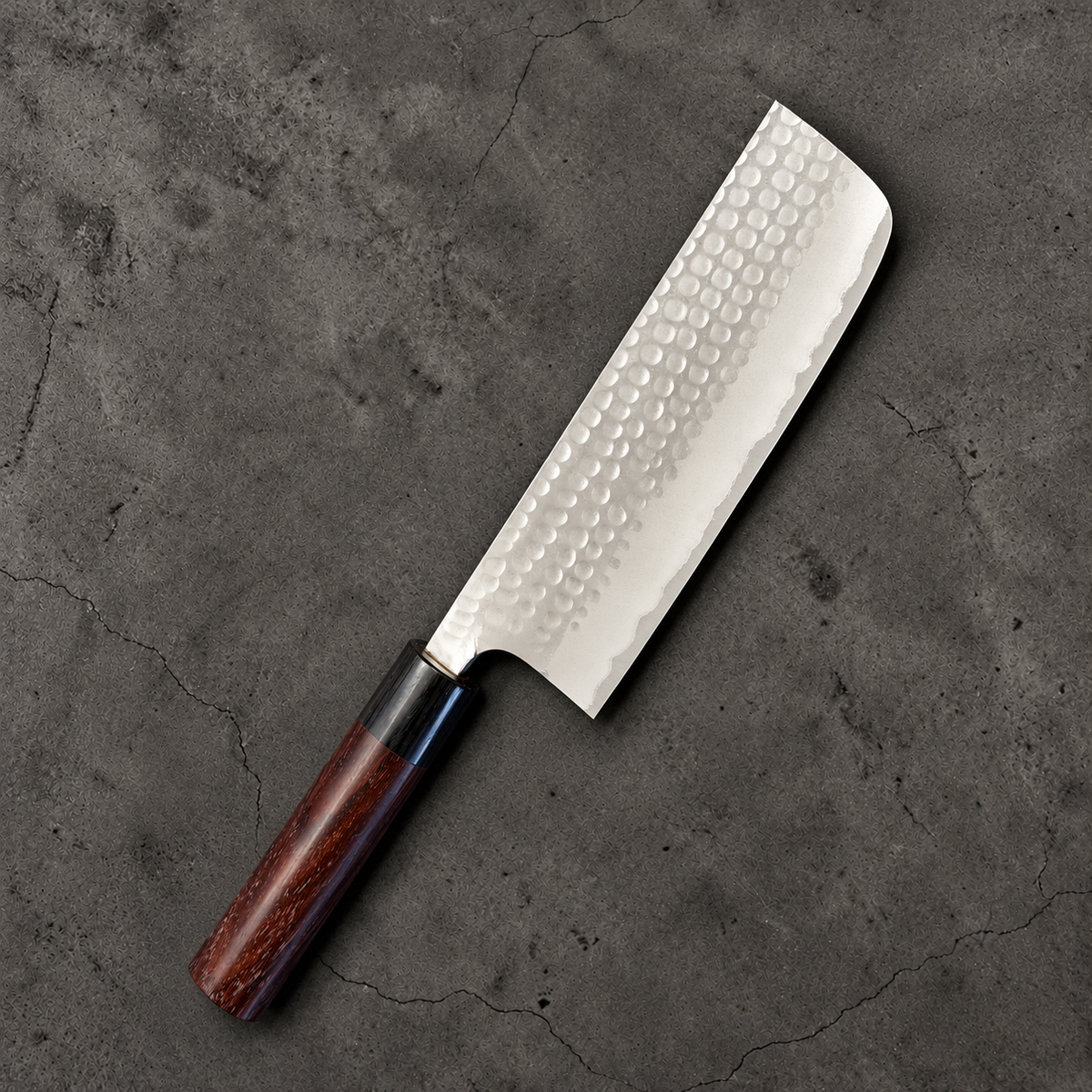 Reverse side of Anryu Blue #2 Nakiri 165mm showing hammered stainless cladding and rosewood handle