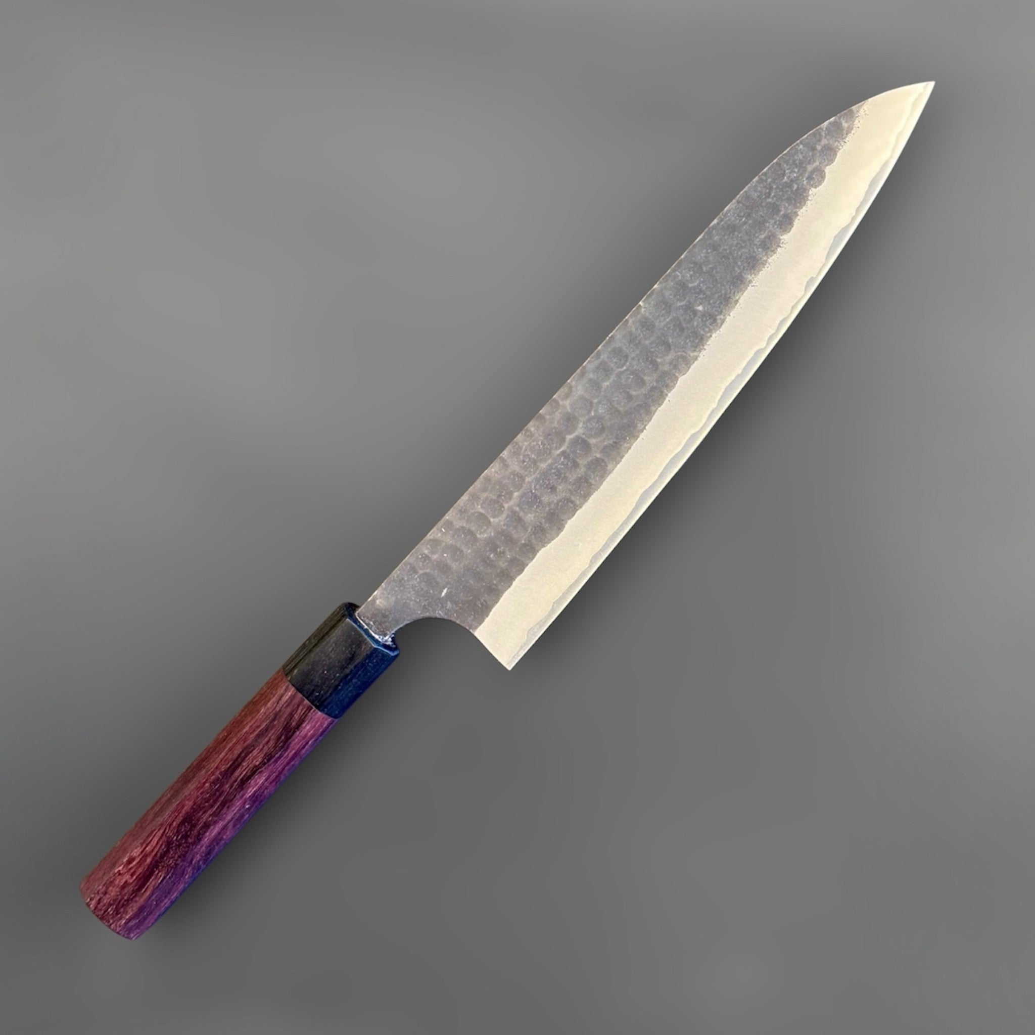 Anryu Aogami Super Kurouchi Gyuto 210 mm, angled reverse-side close-up emphasizing the blade finish, distal taper, and octagonal wa handle.
