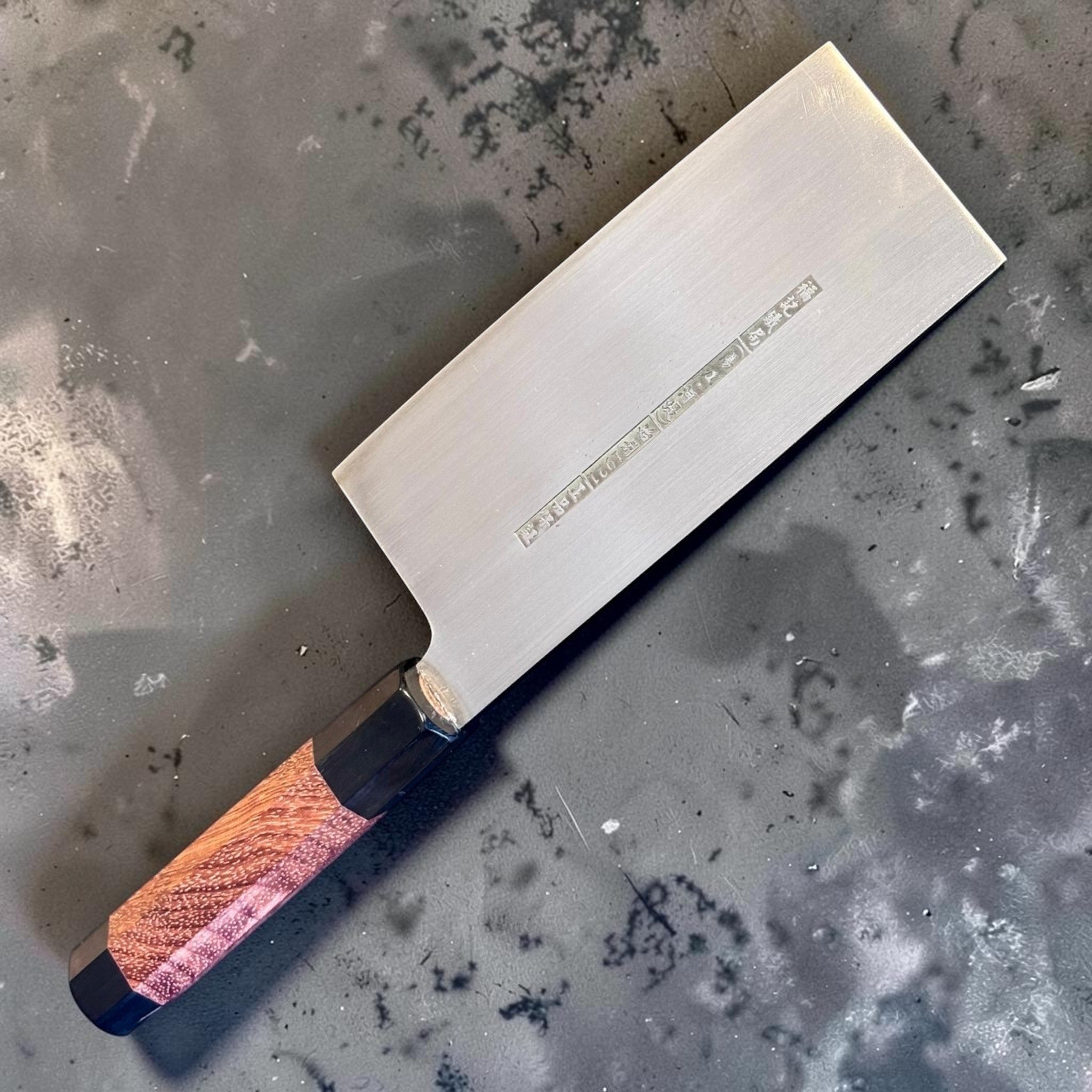 Fook Kee Model #3 stainless steel 180 mm Chinese vegetable cleaver with custom wa handle and buffalo horn accents, close angled view of stamped blade.