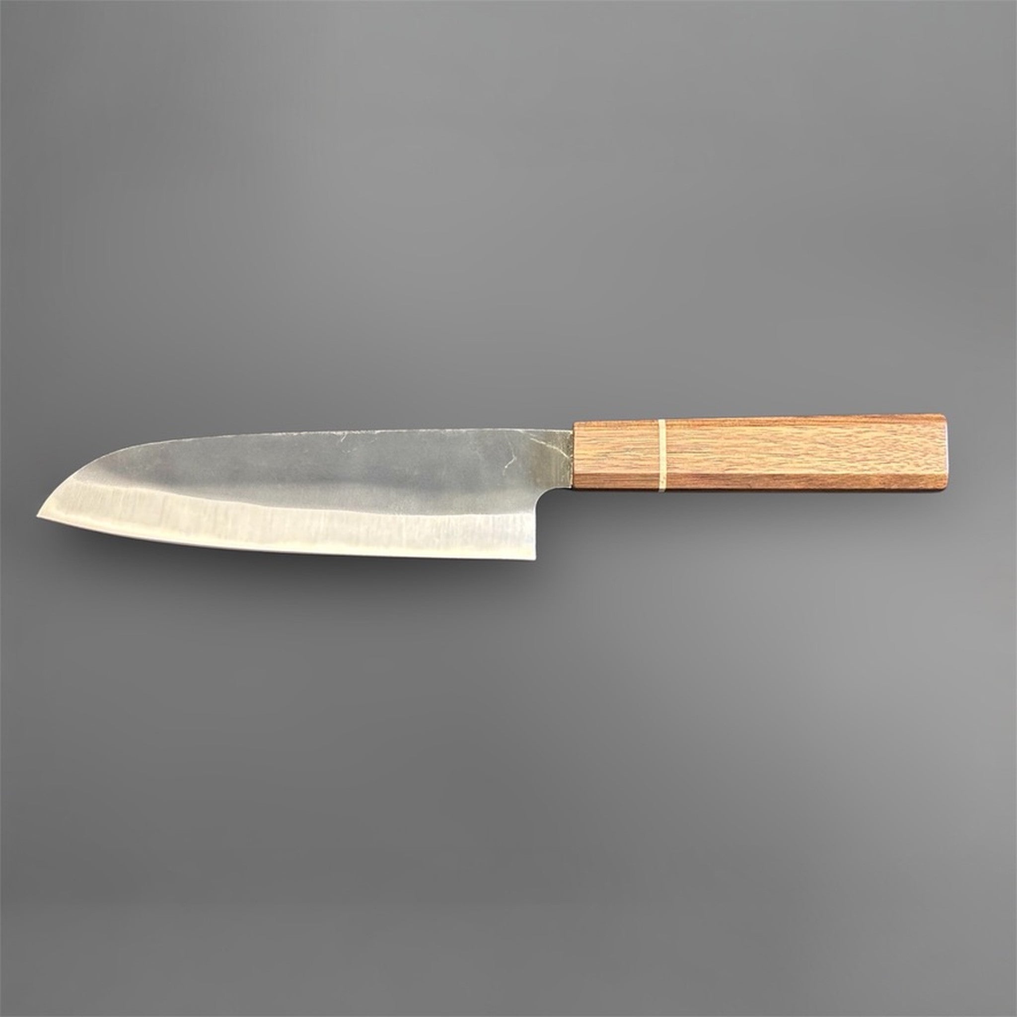 Hatsukokoro Aokitae Blue #2 Kurouchi Santoku 180 mm with Sanjo walnut handle and maple stripe, full reverse side profile on gray background.