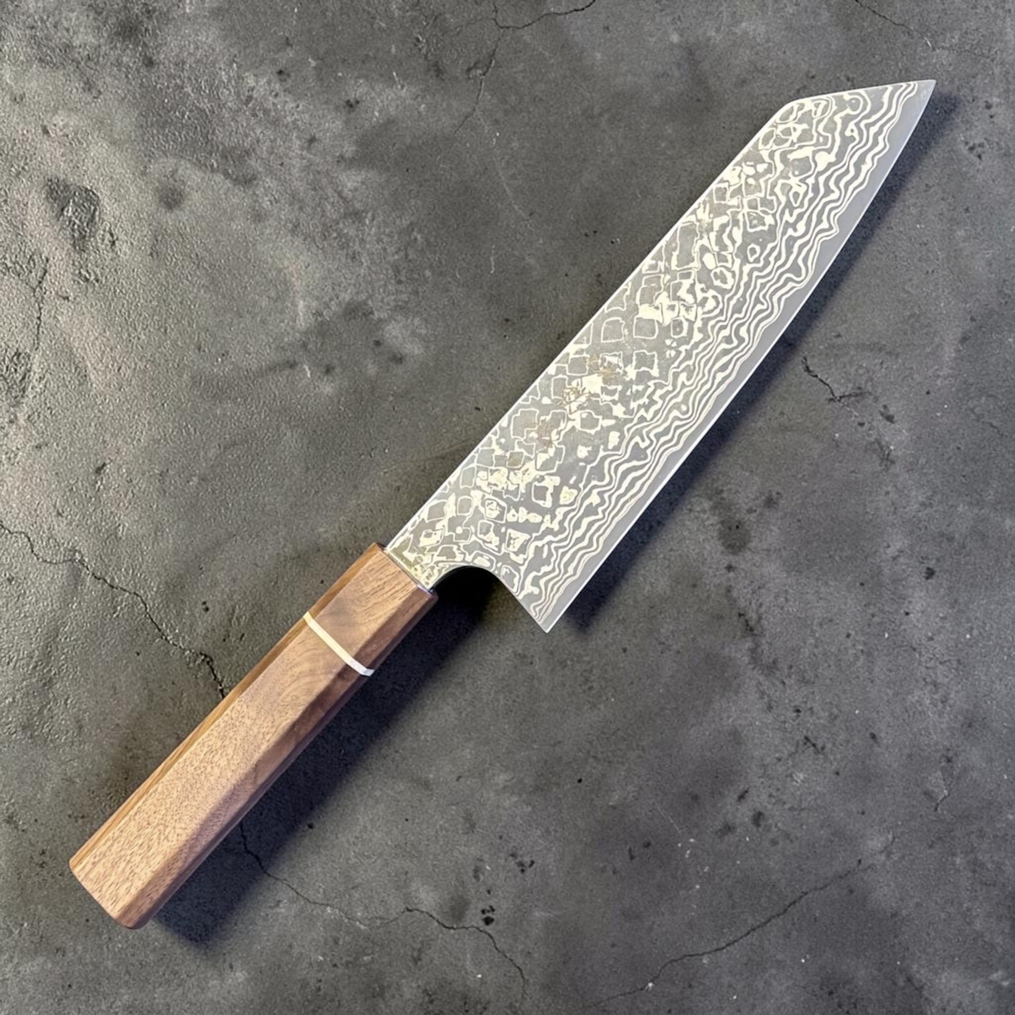 Hatsukokoro Ginga ATS-34 Nickel Damascus Bunka 170 mm with Sanjo walnut handle and maple stripe, angled view showing the blade pattern and handle.
