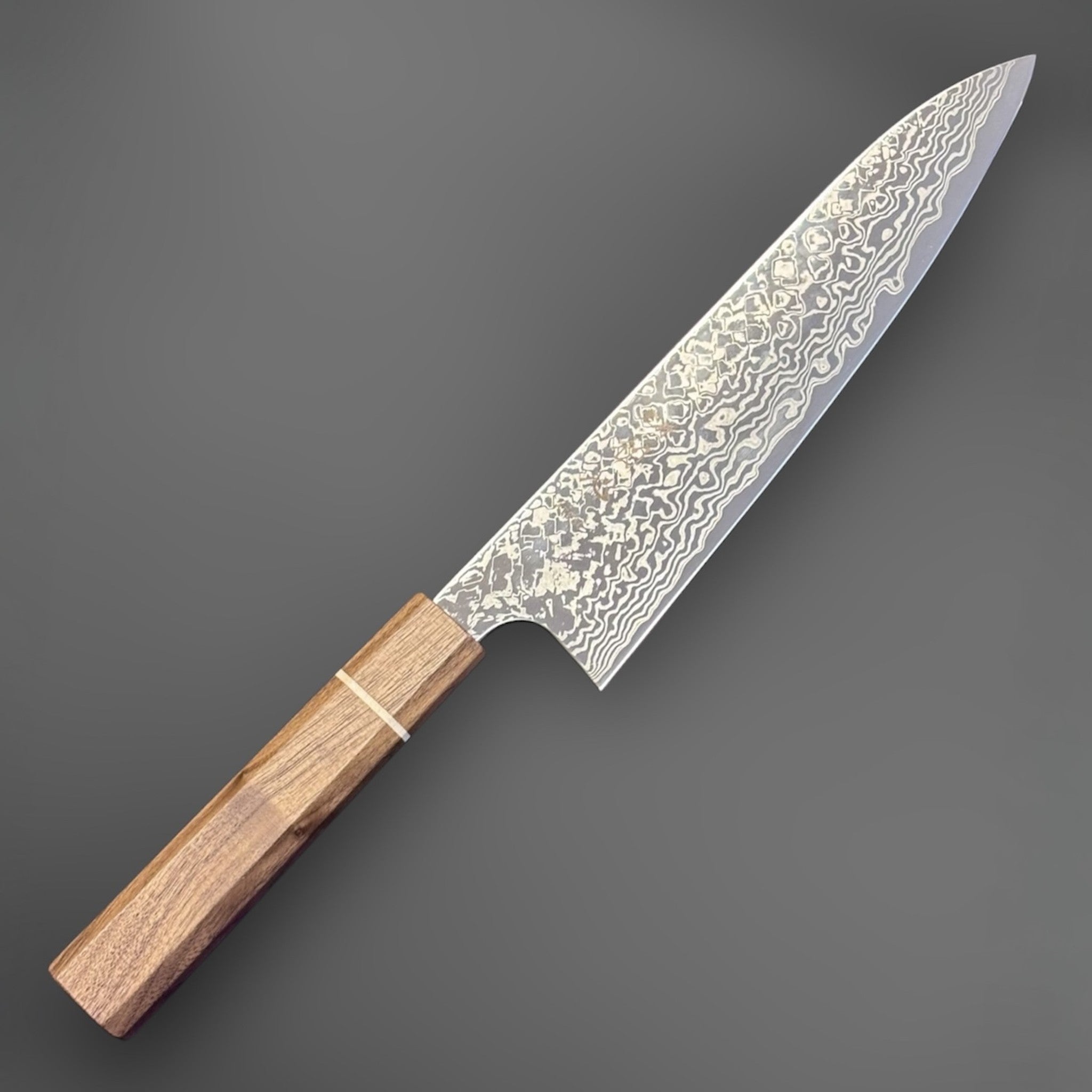 Hatsukokoro Ginga ATS-34 Nickel Damascus Gyuto 210 mm with Sanjo walnut handle and maple stripe, angled view highlighting the Damascus pattern and wa handle.