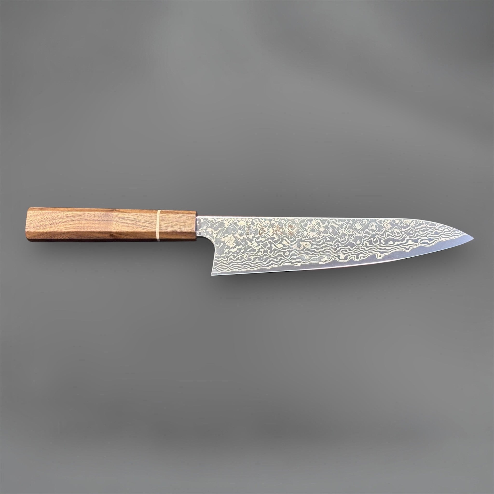 Hatsukokoro Ginga ATS-34 Nickel Damascus Gyuto 210 mm with Sanjo walnut handle and maple stripe, full profile view showing the patterned blade.