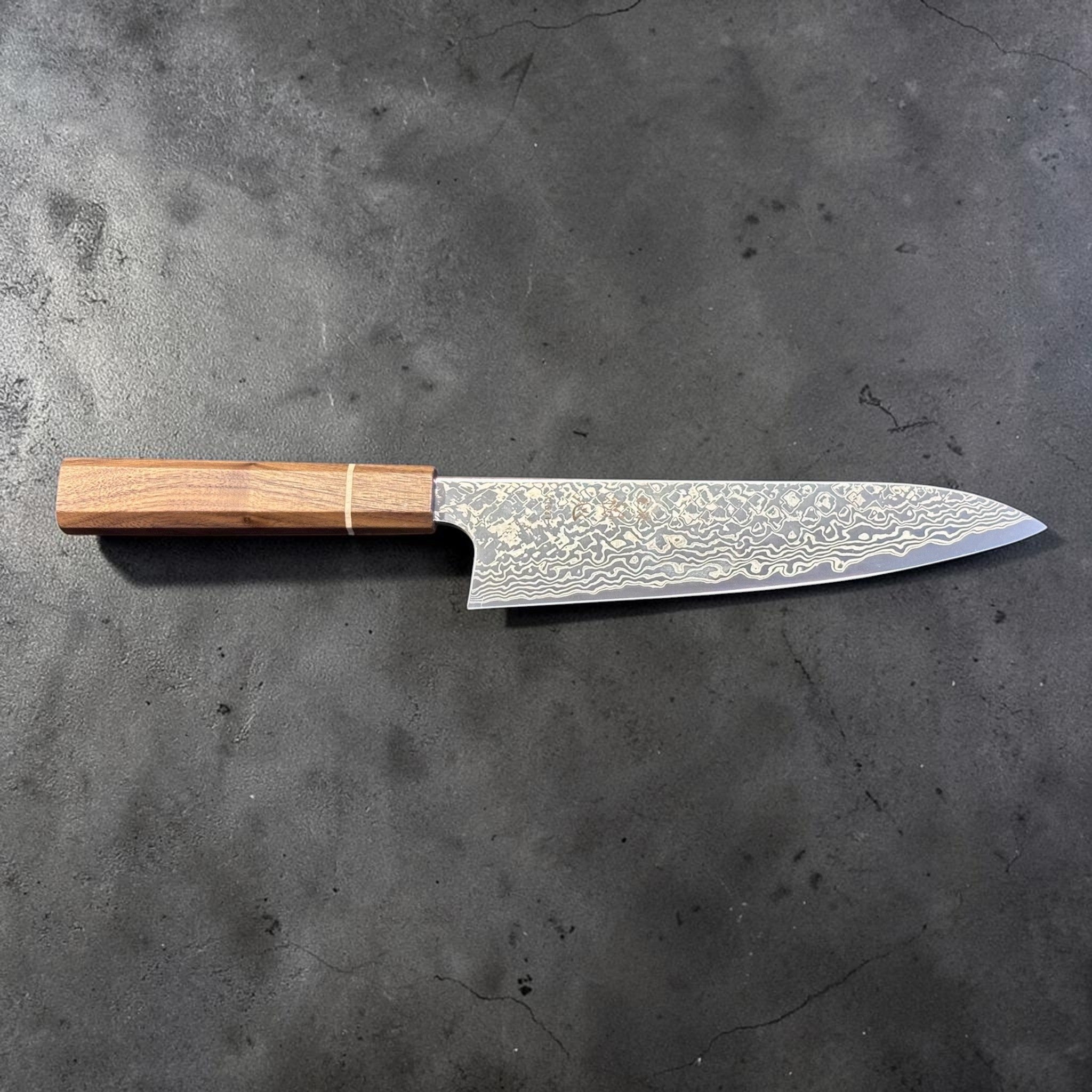 Hatsukokoro Ginga ATS-34 Nickel Damascus Gyuto 210 mm with Sanjo walnut handle and maple stripe, full profile view showing the patterned blade.