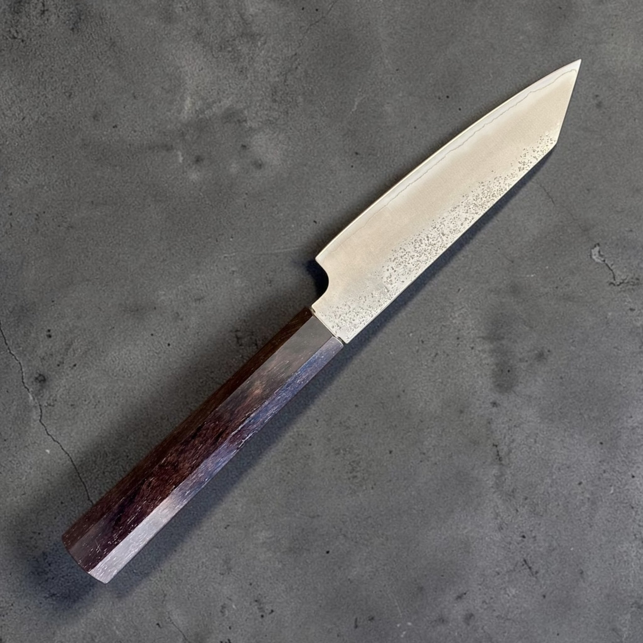 Hatsukokoro Ginrei Silver #3 Kiritsuke Petty 125 mm, angled view showing kiritsuke petty tip and ebony handle.