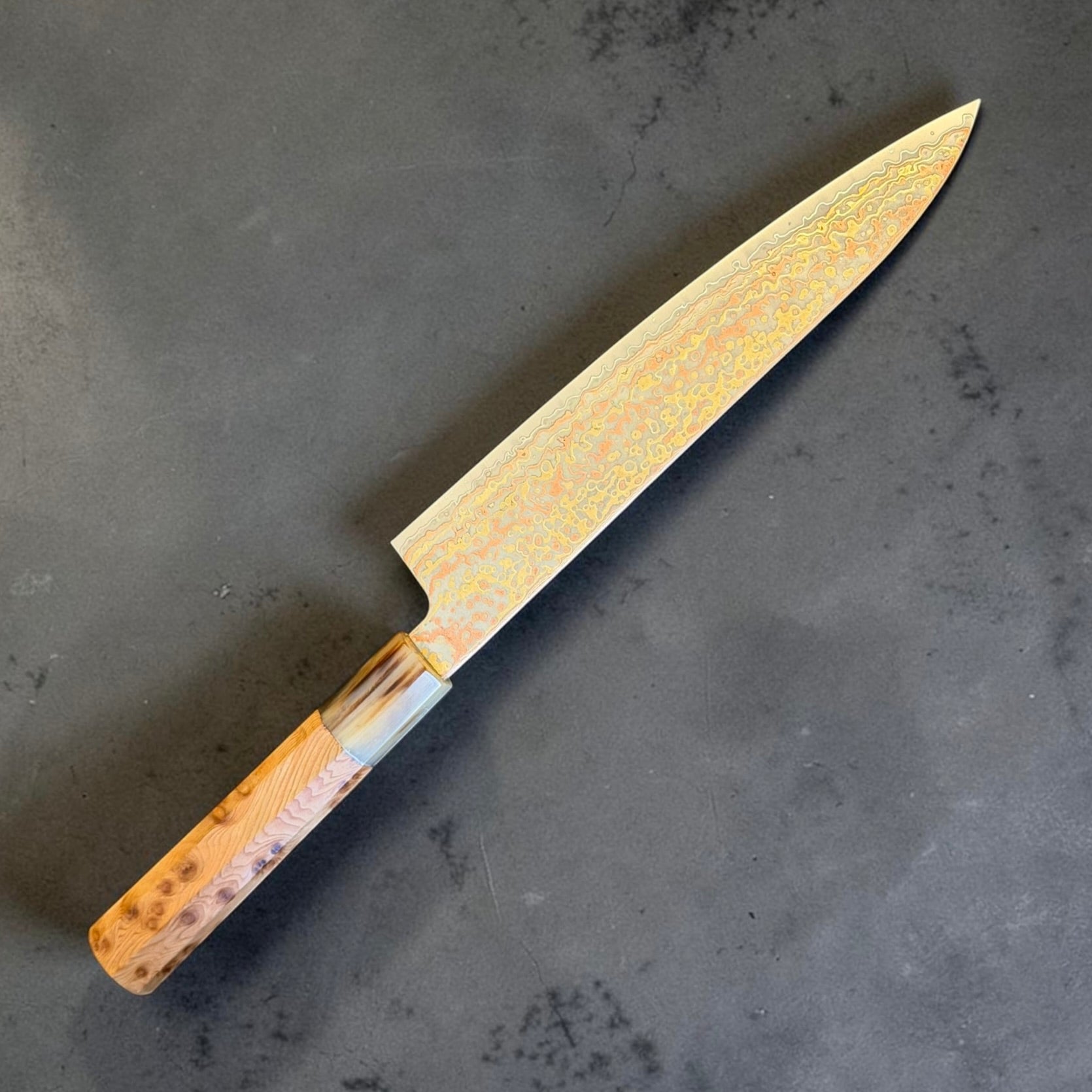 Hatsukokoro Hinotori V-Toku2 Rainbow Damascus Gyuto 210mm with cypress and horn handle, angled view