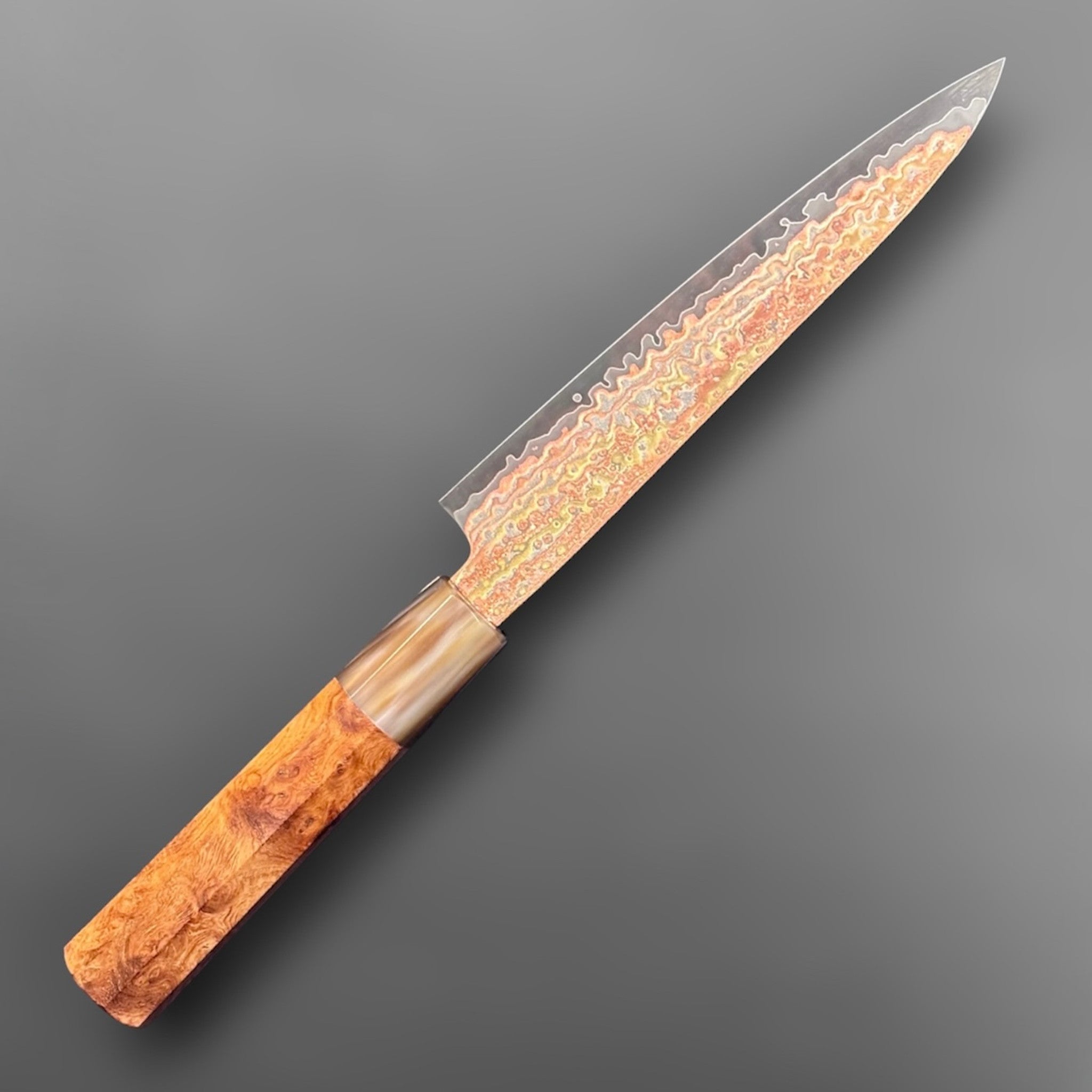 Hatsukokoro Hinotori V-Toku2 Rainbow Damascus Petty 150 mm with Amboyna Burl handle, alternate angled full knife view.