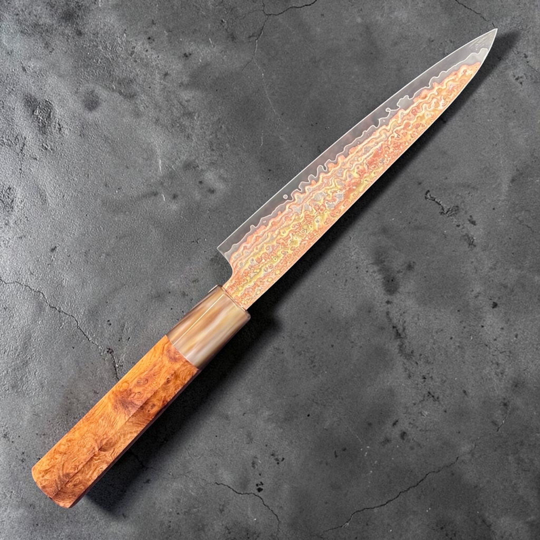 Hatsukokoro Hinotori V-Toku2 Rainbow Damascus Petty 150 mm with Amboyna Burl handle, alternate angled full knife view.