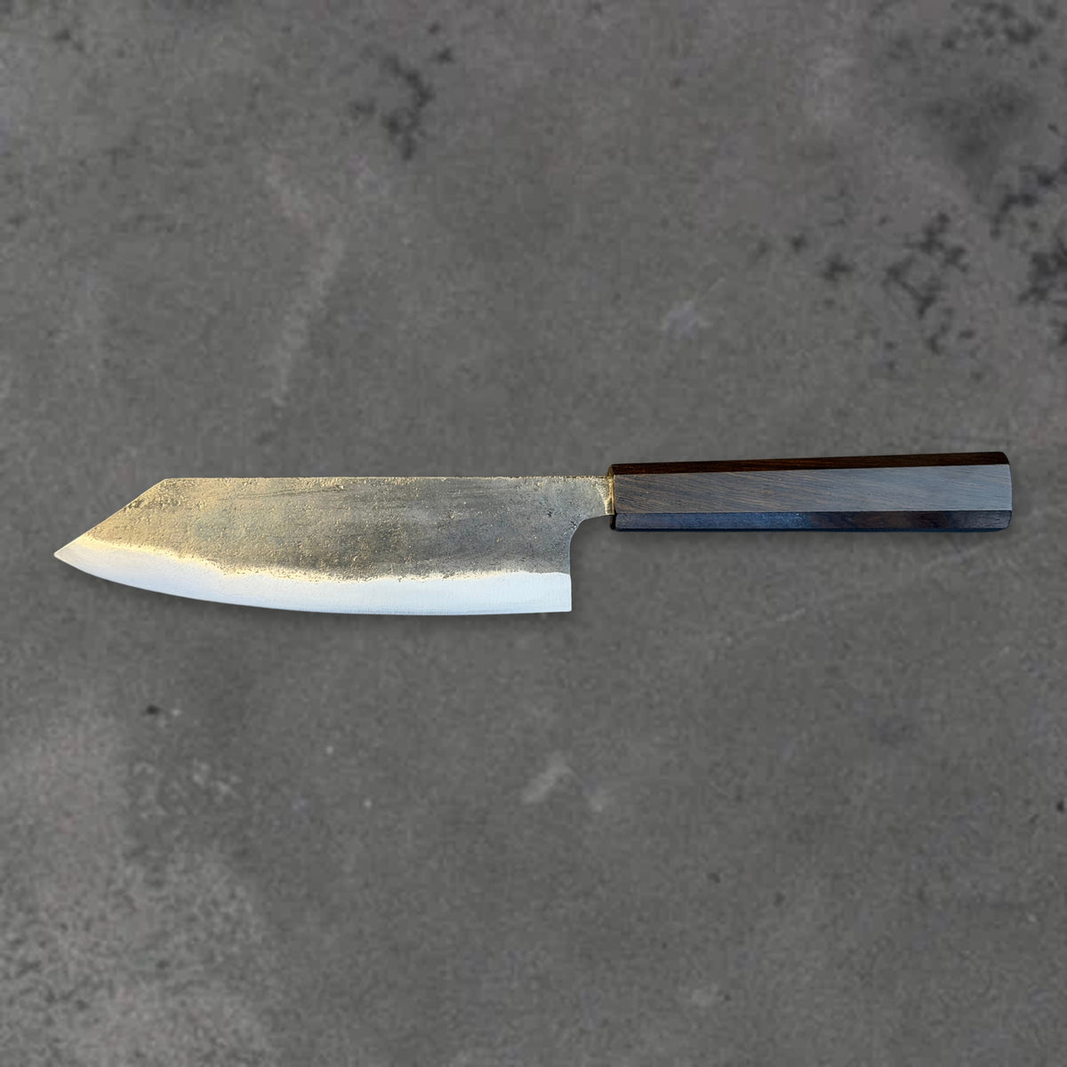 Hatsukokoro Kurogane Blue #2 Kurouchi 165mm bunka with ebony handle, shown in horizontal reverse profile with the full blade and handle visible.