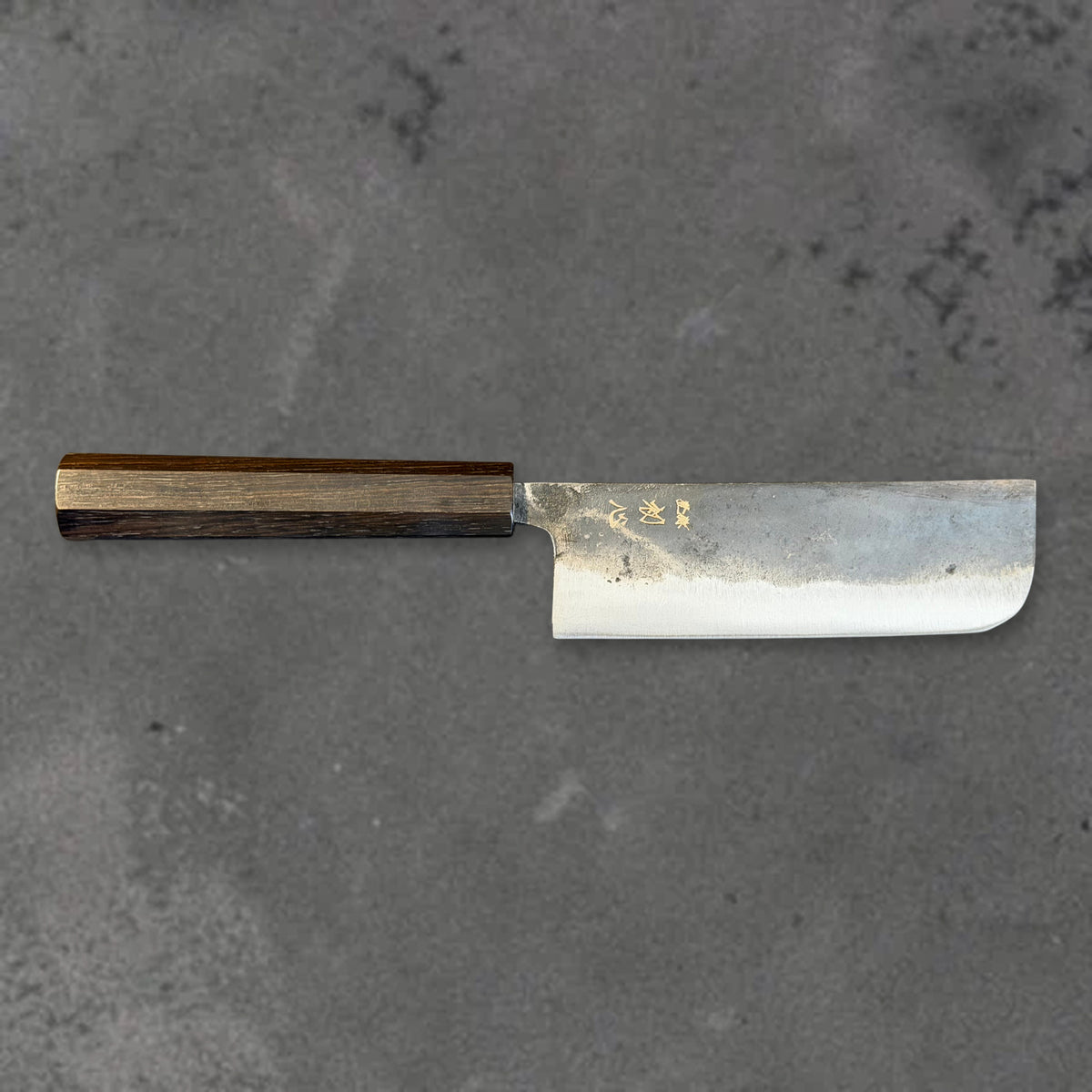 Hatsukokoro Kurogane Blue #2 Kurouchi 120mm nakiri with ebony handle, shown in horizontal front profile with the full blade and handle visible. #Handle_Mono Ebony