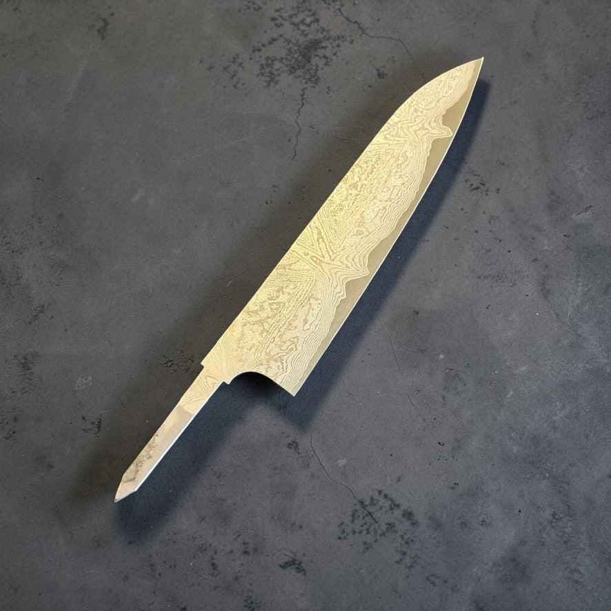 Angled front view of the Hatsukokoro VG-XEOS Kurozome Damascus Gyuto 210mm blade with exposed tang and no handle.