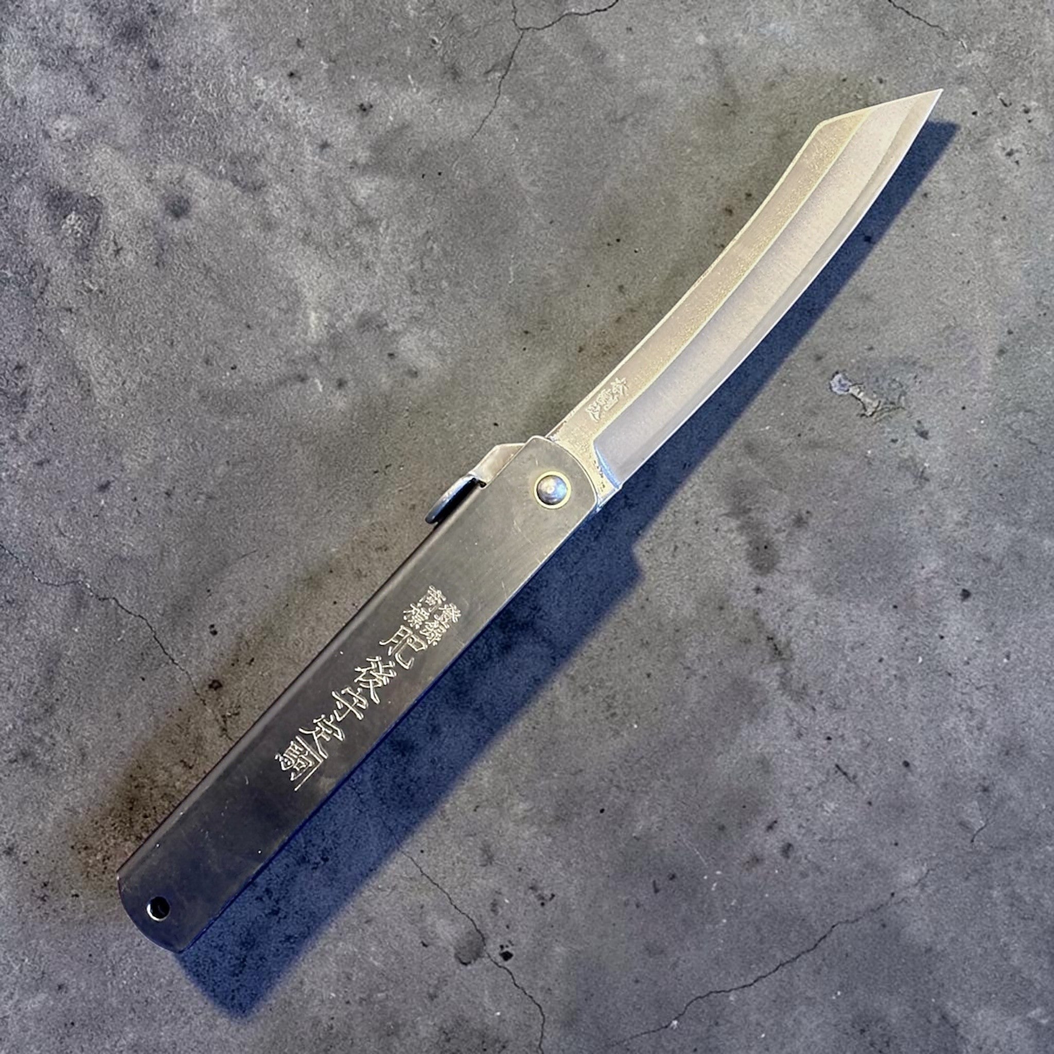 Higonokami Carbon Steel Japanese Friction Folder, three-quarter product view with blade open.