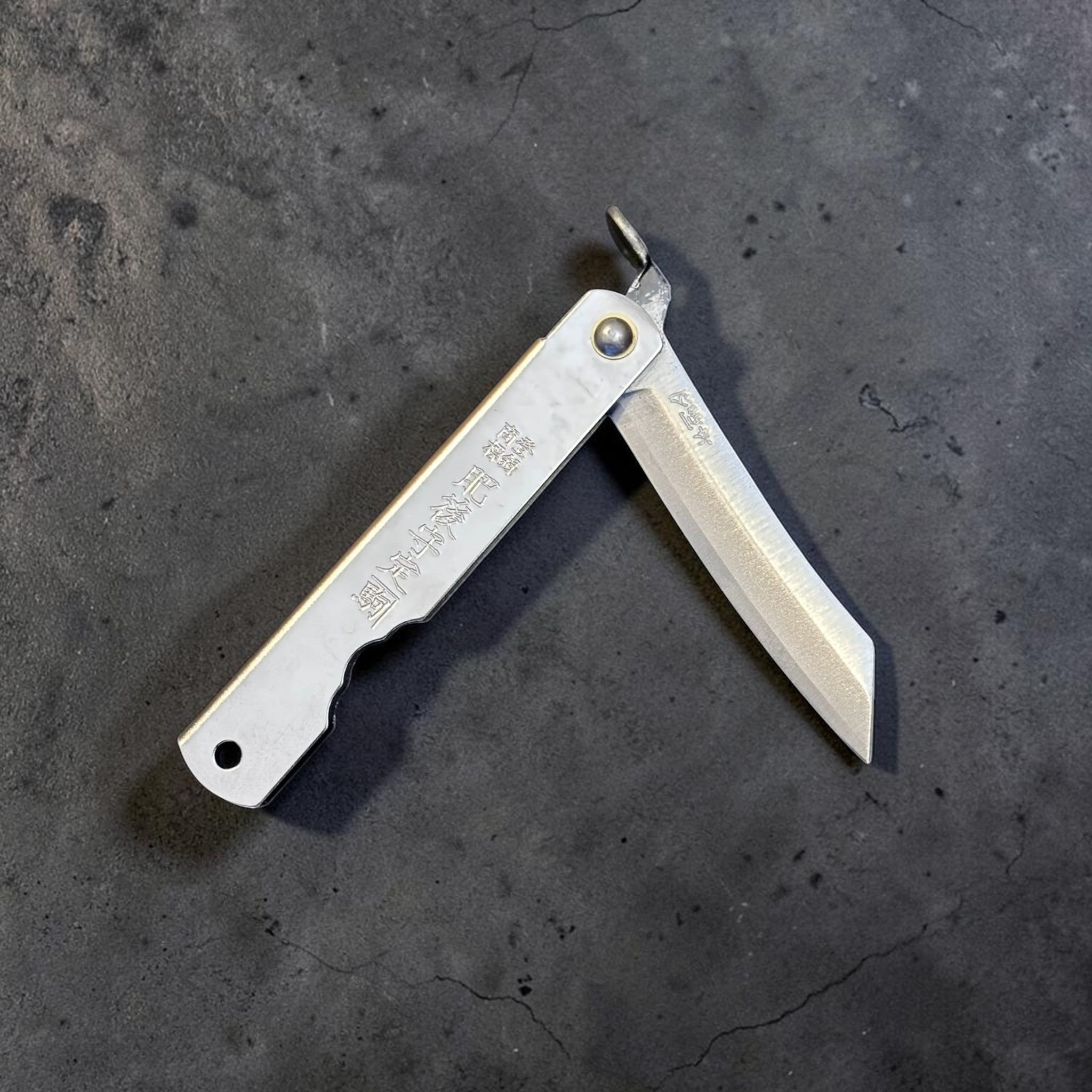 Higonokami Silver Small folding knife, partially open display showing traditional friction folder construction and silver handle.