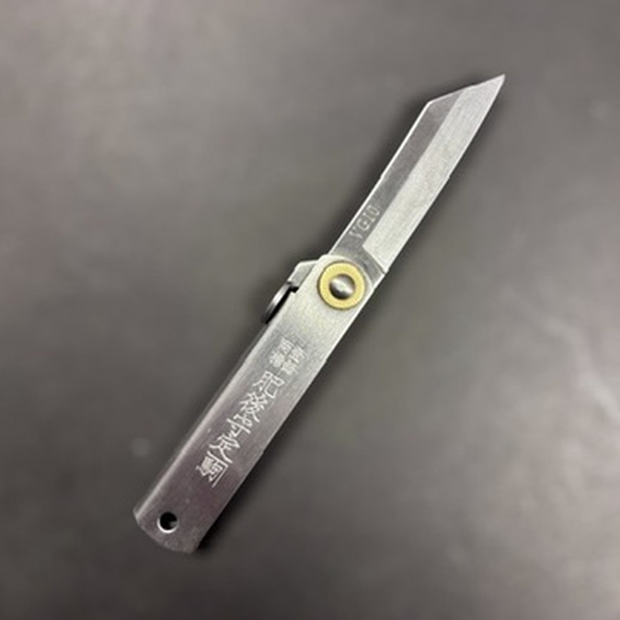 Higonokami VG‑10 Japanese pocket knife (Small), blade extended, reverse side with VG10 mark visible near the spine.