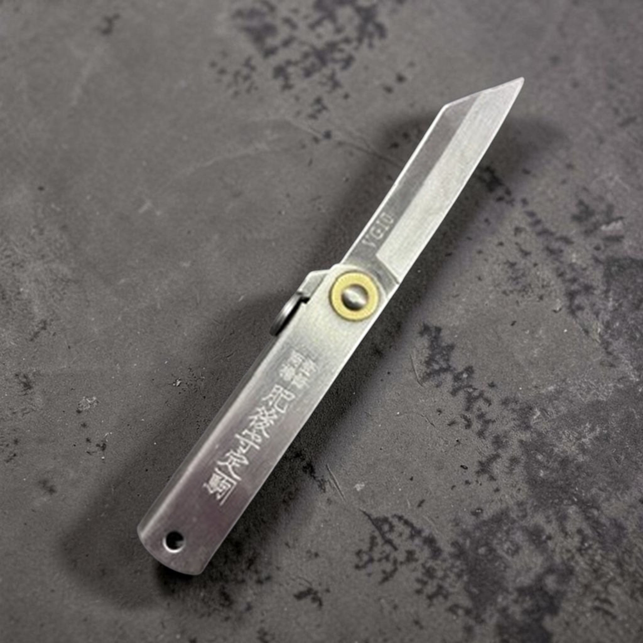 Higonokami VG‑10 Japanese pocket knife (Small), blade extended, reverse side with VG10 mark visible near the spine.