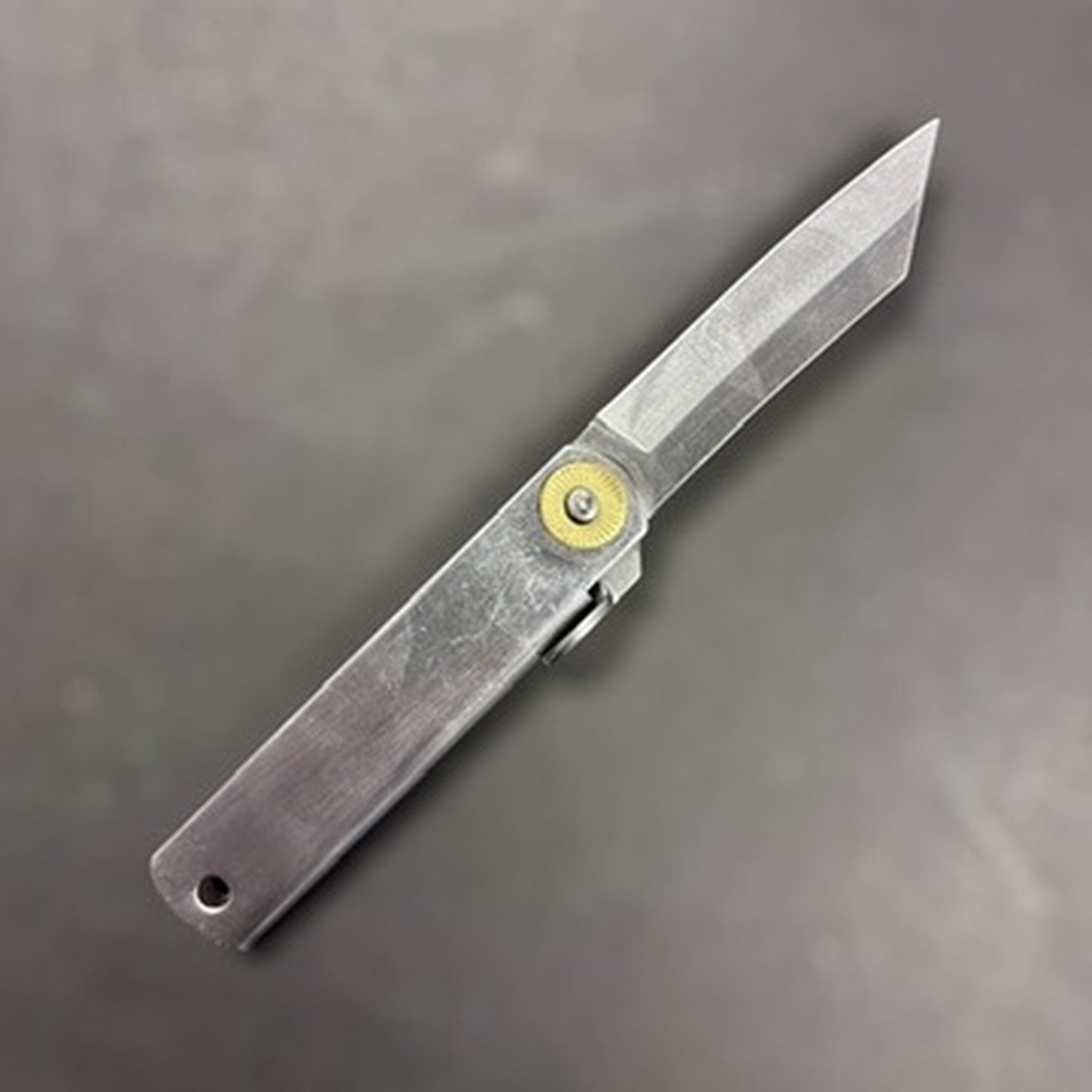 Higonokami VG‑10 Japanese pocket knife (Small), full profile shot with tanto-style tip and satin finish.