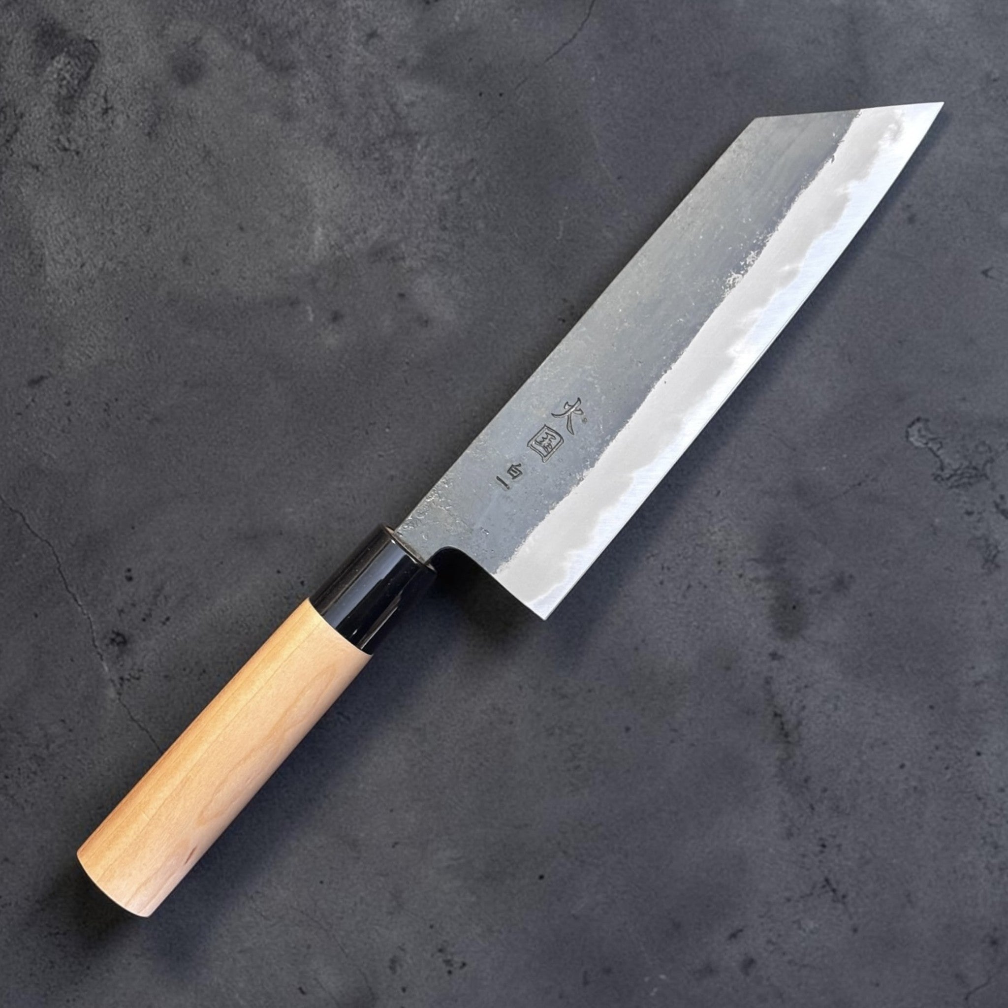 Hinokuni White #1 Kurouchi Bunka, reverse angled view showing maker kanji and kurouchi blade finish.