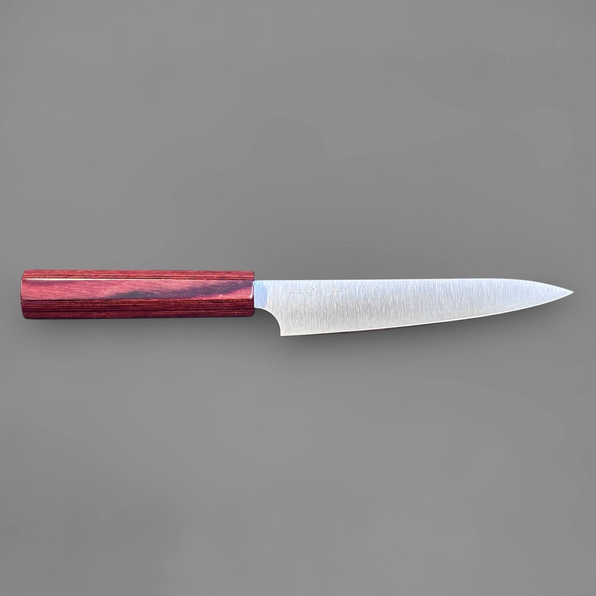 Kei Kobayashi SG2 Migaki petty knife with red wa handle, reverse full profile highlighting the sleek grind and octagonal handle shape.