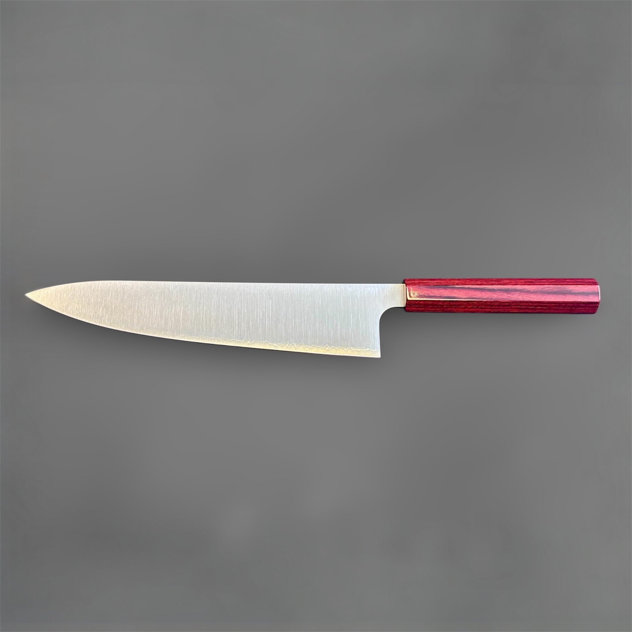 Kei Kobayashi SG2 Gyuto 240 mm with red lacquer handle, full reverse-side profile showing the sleek blade shape, satin finish, and red lacquer wa handle.