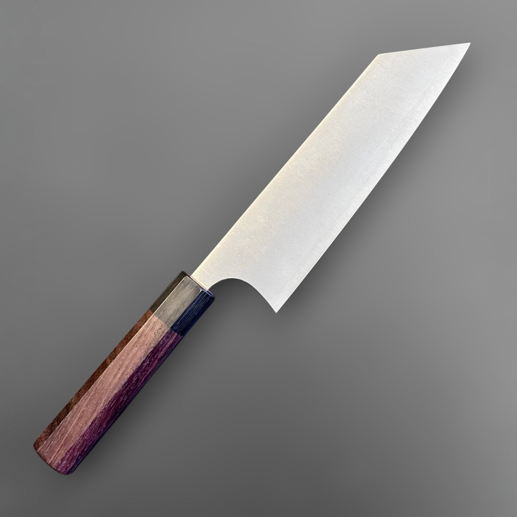 Koutetsu SG2 Bunka 180 mm with rosewood octagonal handle, three-quarter view emphasizing the angled k-tip and fine brushed finish.