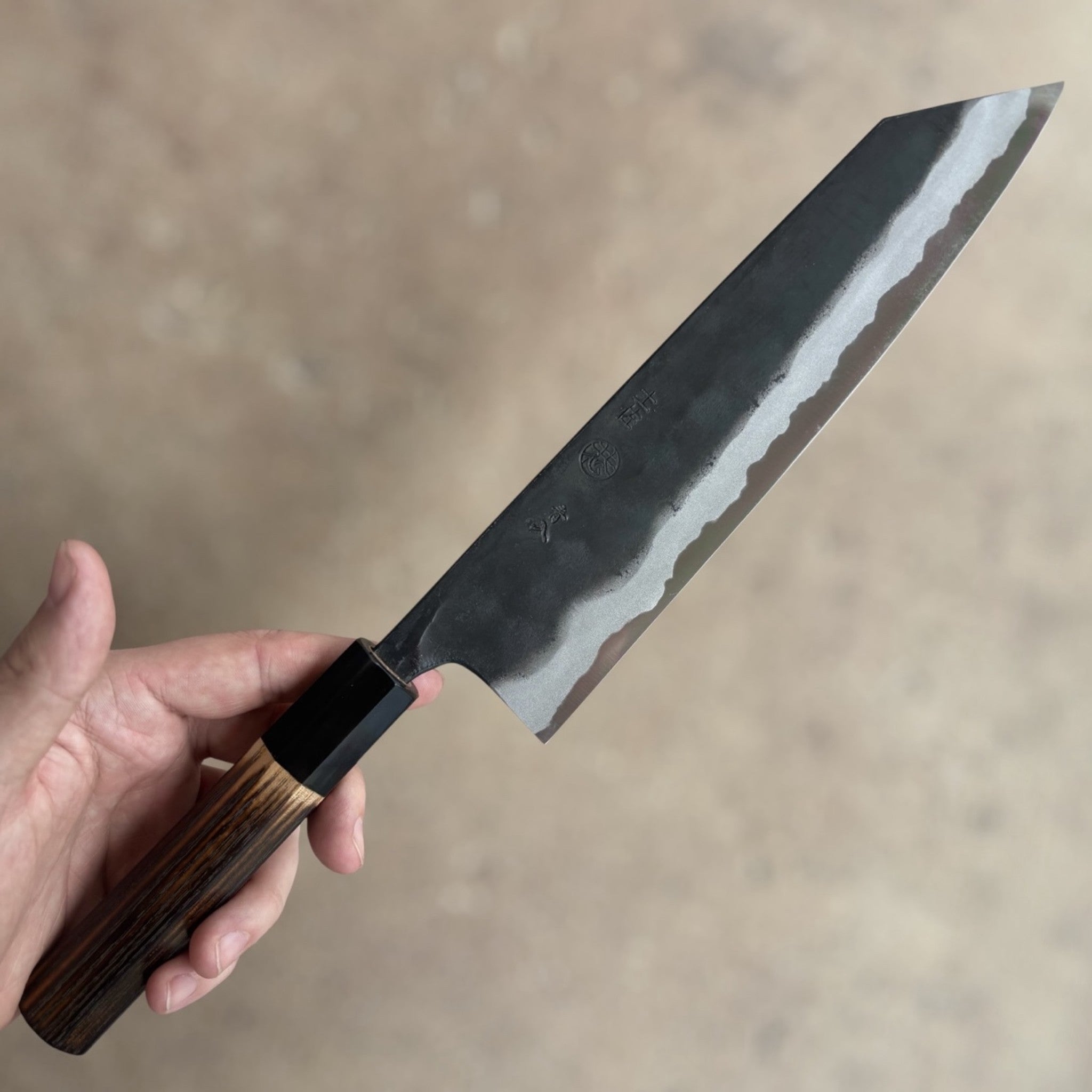 Kyohei Shindo Blue #2 Kurouchi Kiritsuke 210 mm with burnt wood handle and buffalo horn ferrule, reverse side blade profile and kurouchi finish.