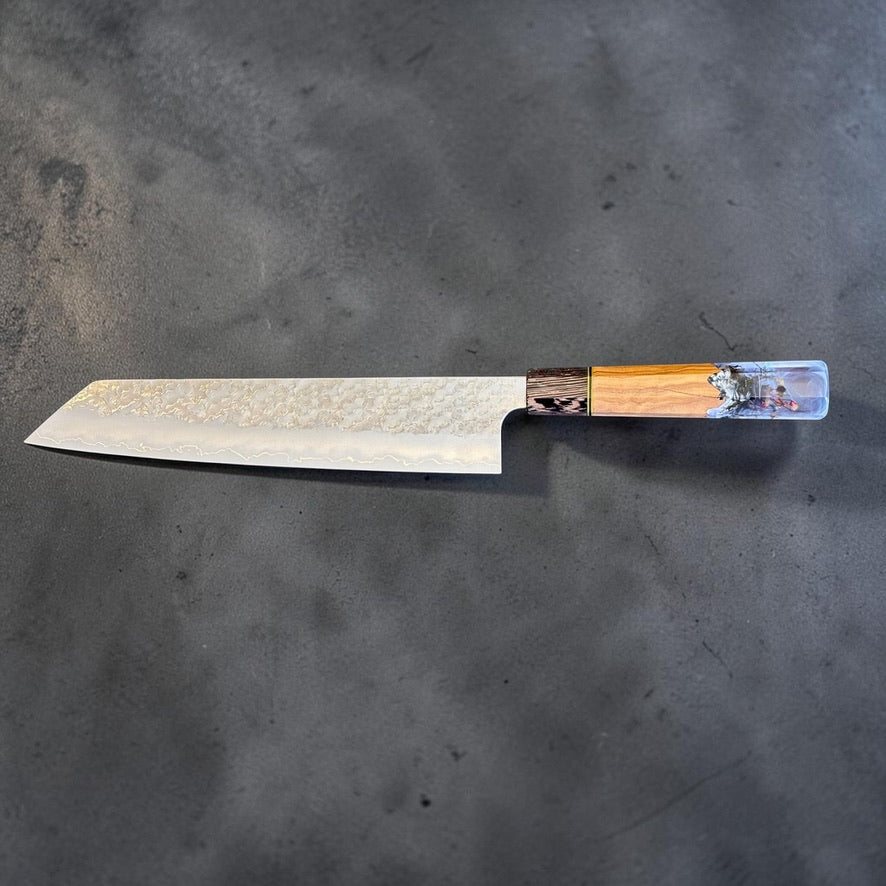 Choil view of Makoto Kurosaki SG2 Bunka 240mm showing thin grind, blade geometry and custom Prisma handle alignment