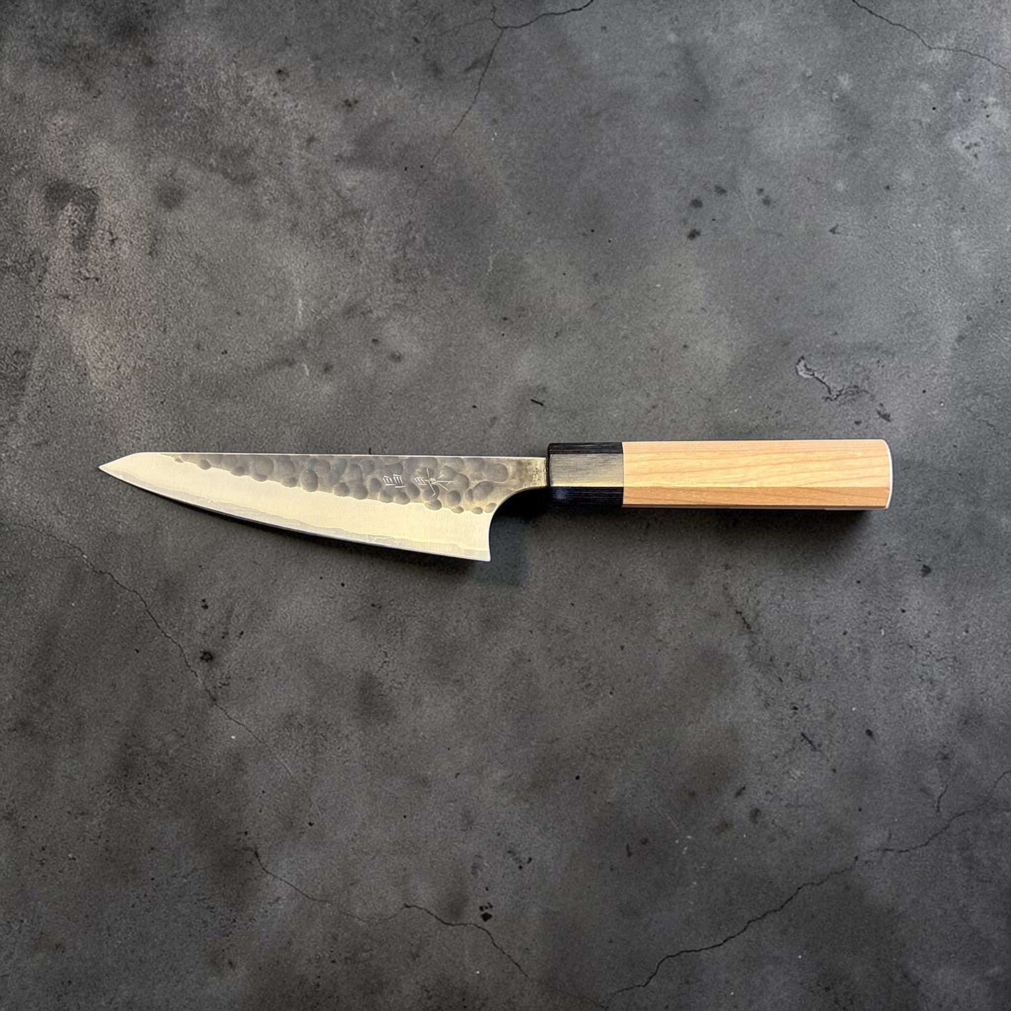Masakage Koishi Honesuki Japanese knife, full opposite-side profile highlighting the hammered blade texture and wa handle.