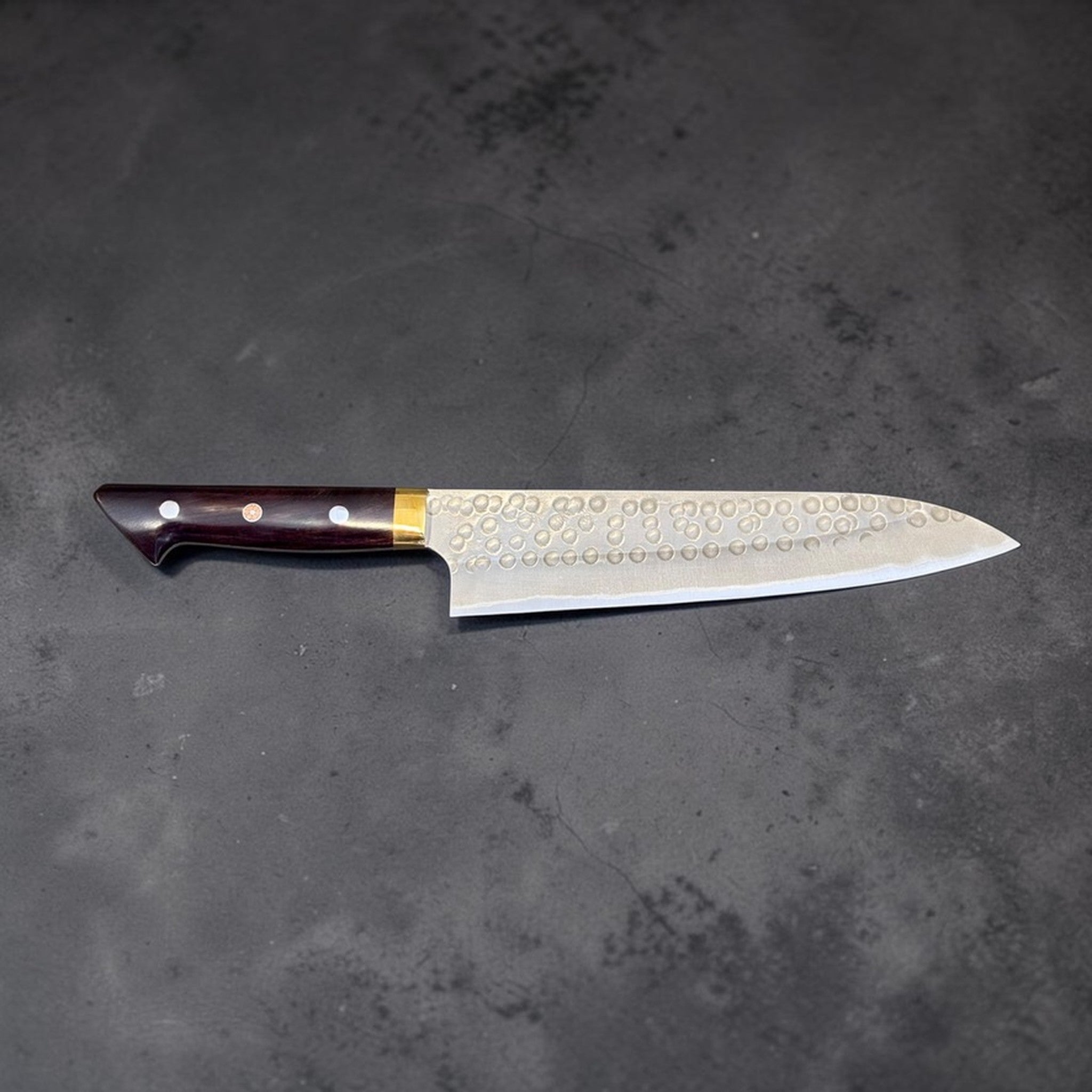 Masakage Zero Gyuto 210 mm, full knife right-facing profile on dark stone background.