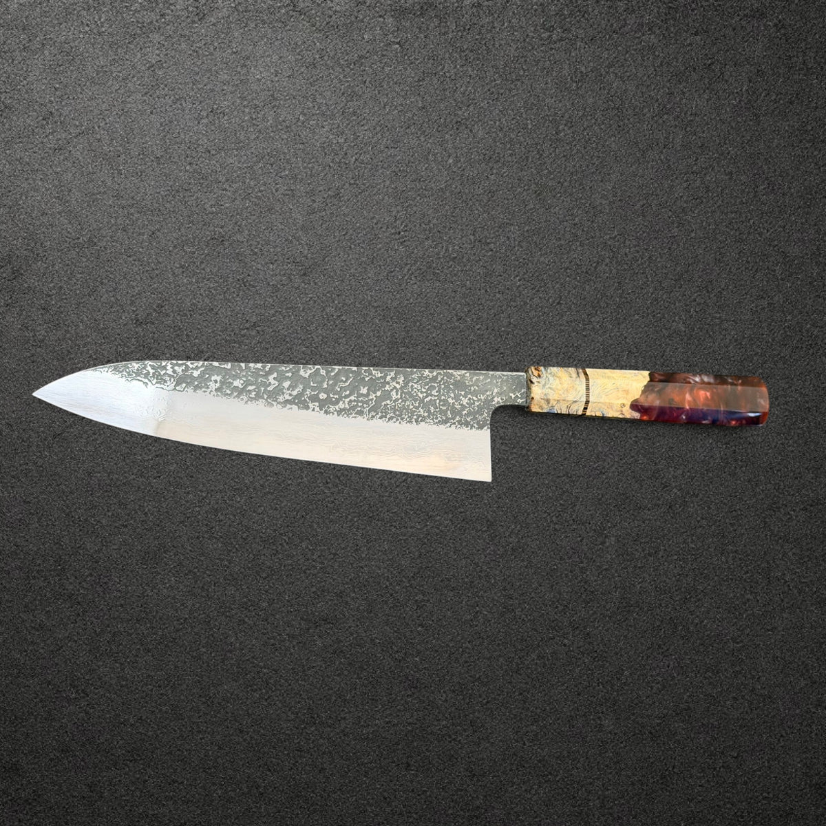 Masuda Kurozome 210mm gyuto reverse-side profile showing Damascus layers and Prisma handle