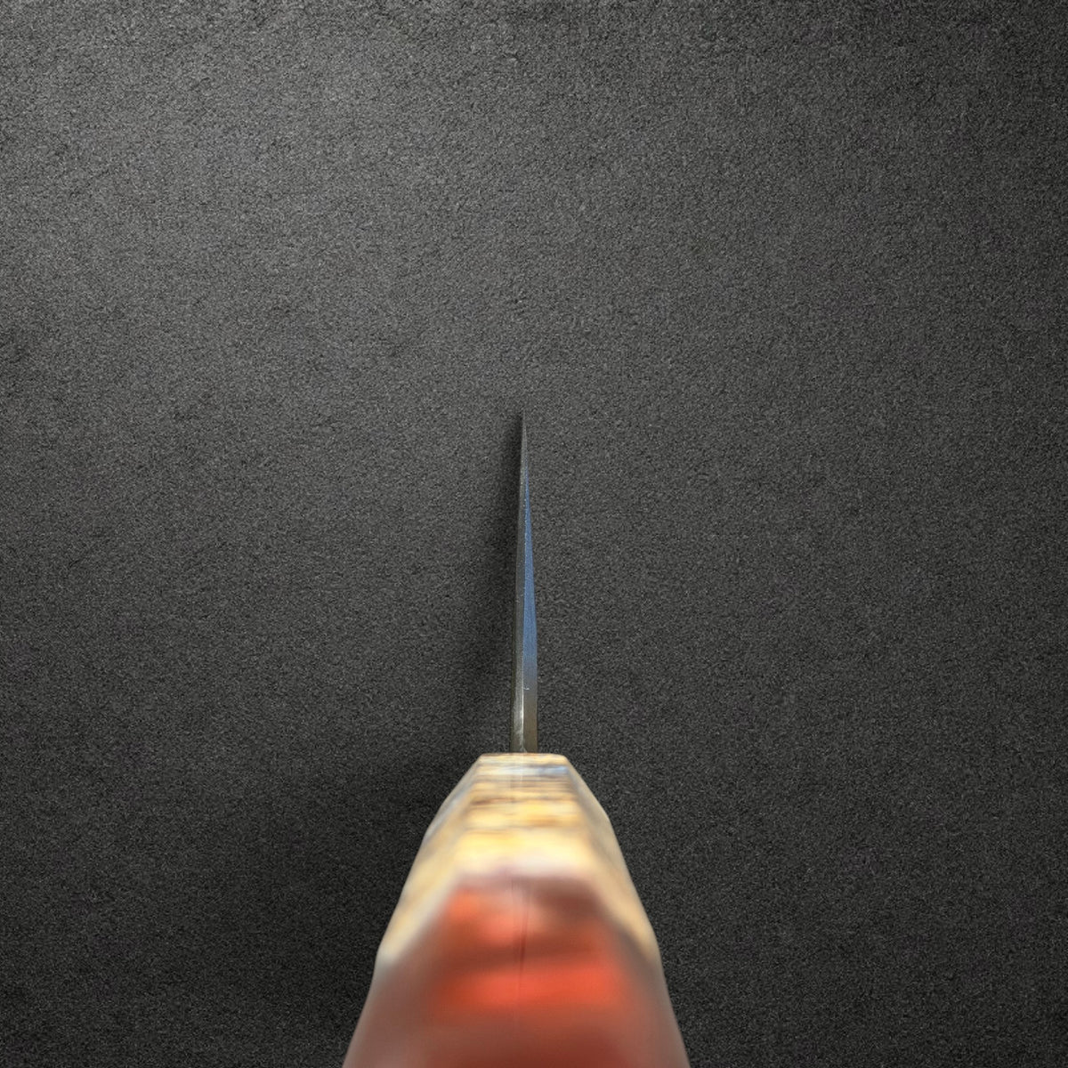 Choil view of Masuda Blue 1 Kurozome Gyuto 210mm looking along the blade from the Prisma handle