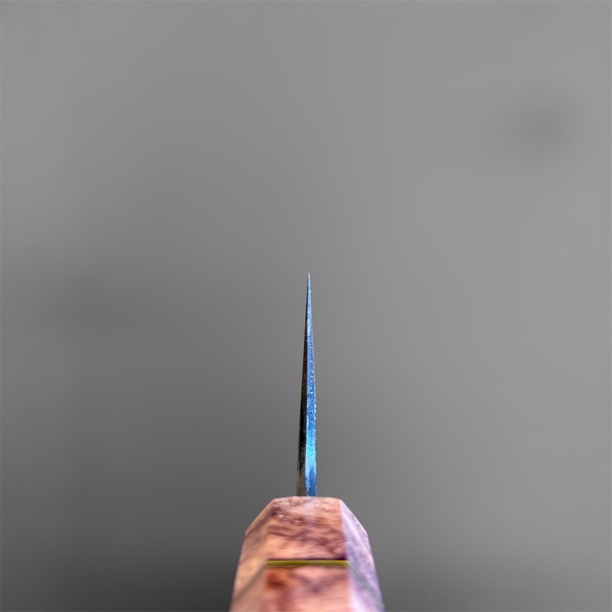 Masuda Yoshihide Blue #1 Kurozome Damascus Gyuto 210 mm with Prisma Knife custom handle, spine view showing thin blade geometry and handle detail.