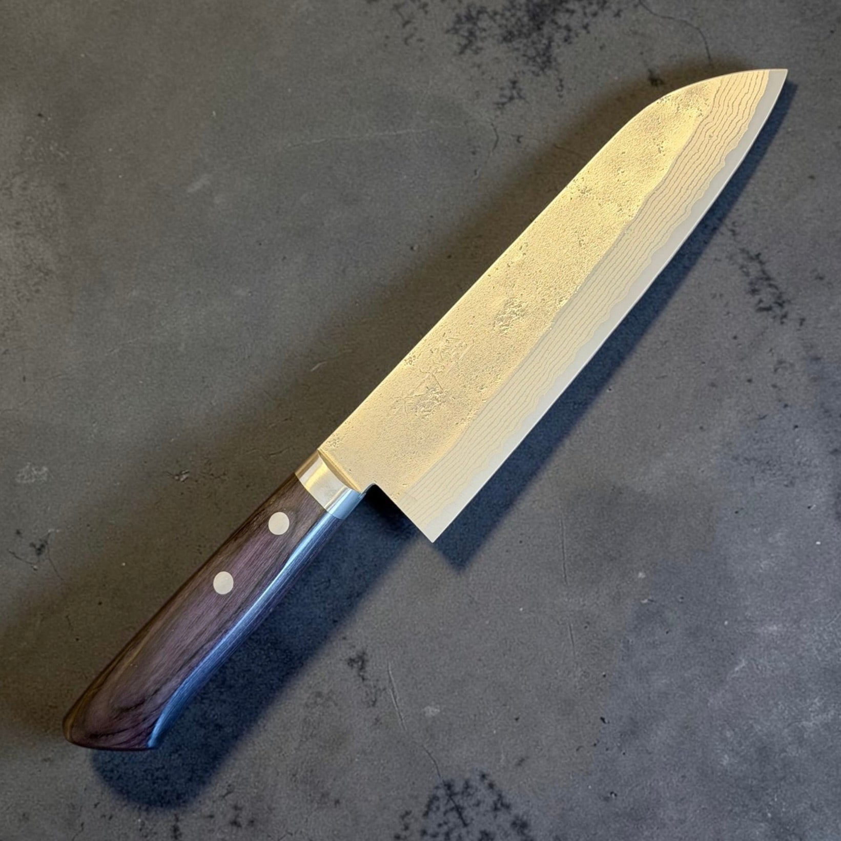 Masutani Sekka VG10 Nashiji Santoku 170mm with black pakkawood handle, angled blade view