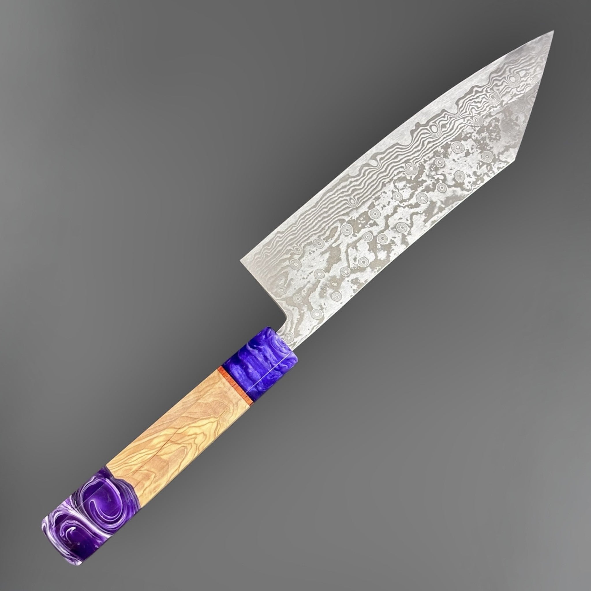 Miyazaki Kajiya ATS-34 Damascus Tsubaki 220 mm with Prisma knife handle, angled full-knife view showing the Damascus blade pattern and purple handle accents.