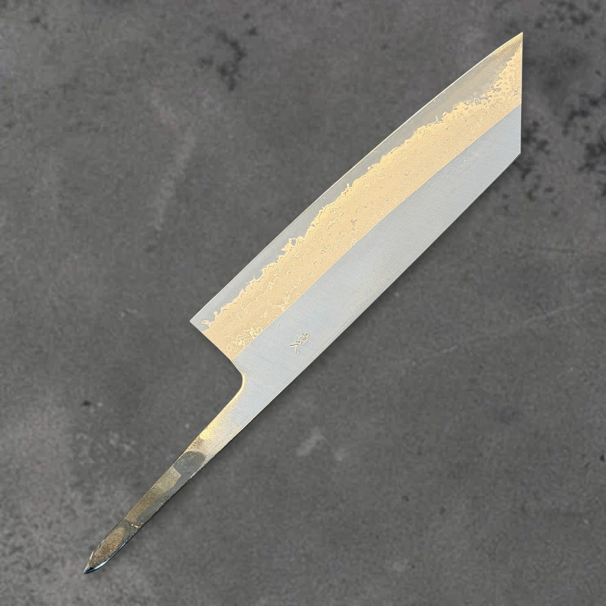 Angled reverse view of the Muneishi Blue #2 Damascus 165mm bunka blade, showing its pointed tip, Damascus pattern, and exposed tang.