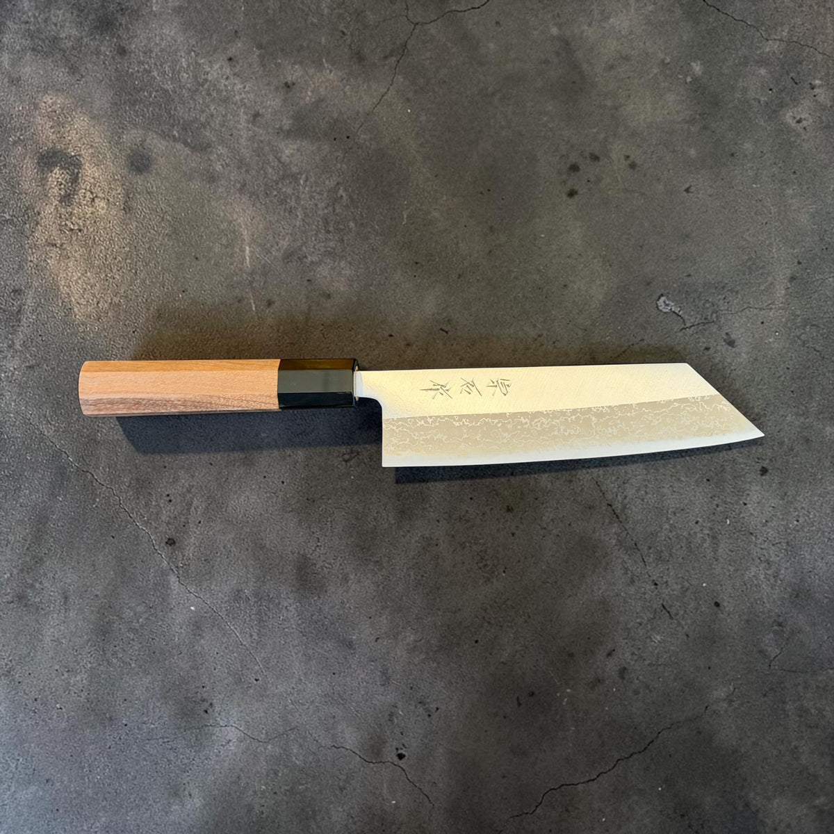 Muneishi 165mm Damascus bunka, front profile with octagonal walnut handle and black horn ferrule
