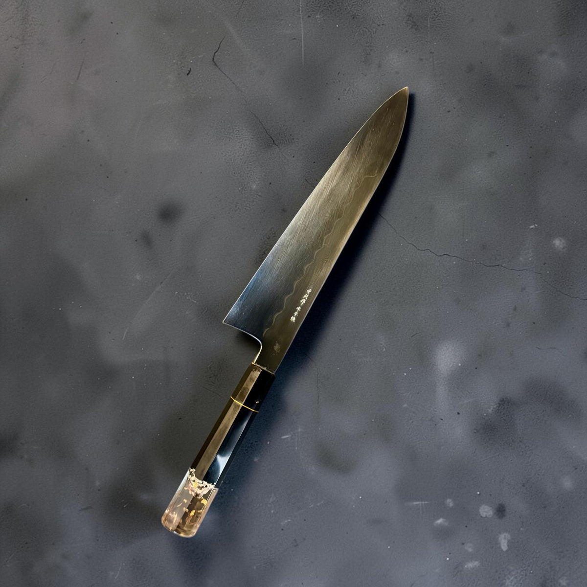 Nakagawa White #2 mizu honyaki 255mm gyuto showing its flowing hamon, maker inscription and fitted Prisma handle