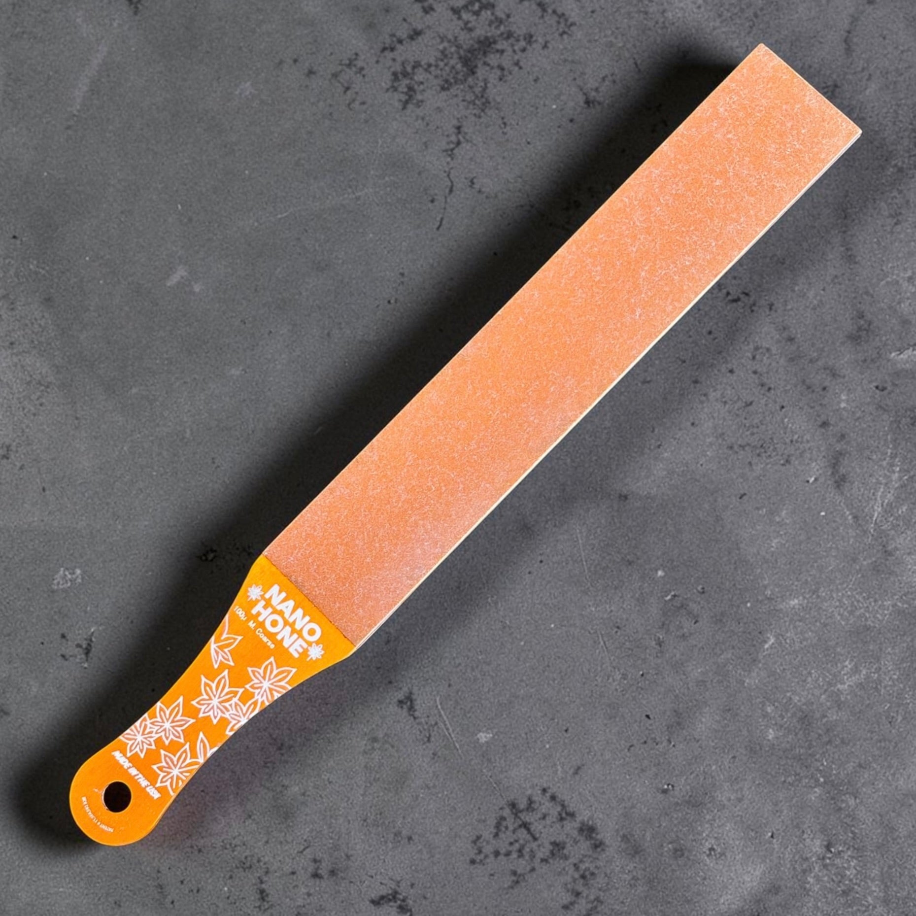 Nano Hone Truer 25/100 paddle strop showing the orange 100 micron coarse diamond resin side