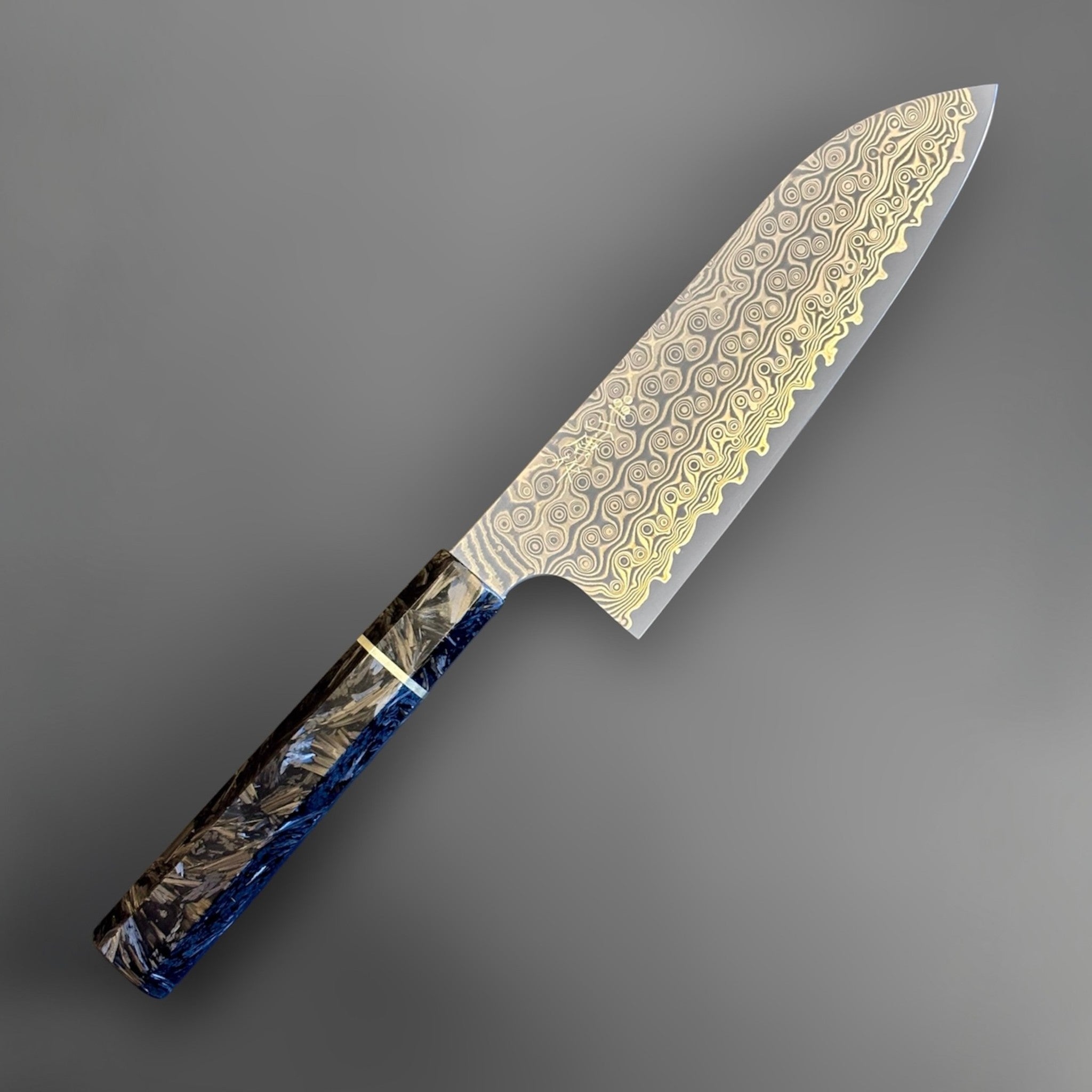Nigara Anmon SG2 Santoku with carbon fiber wa handle, front angled product view showing Damascus pattern and faceted handle.