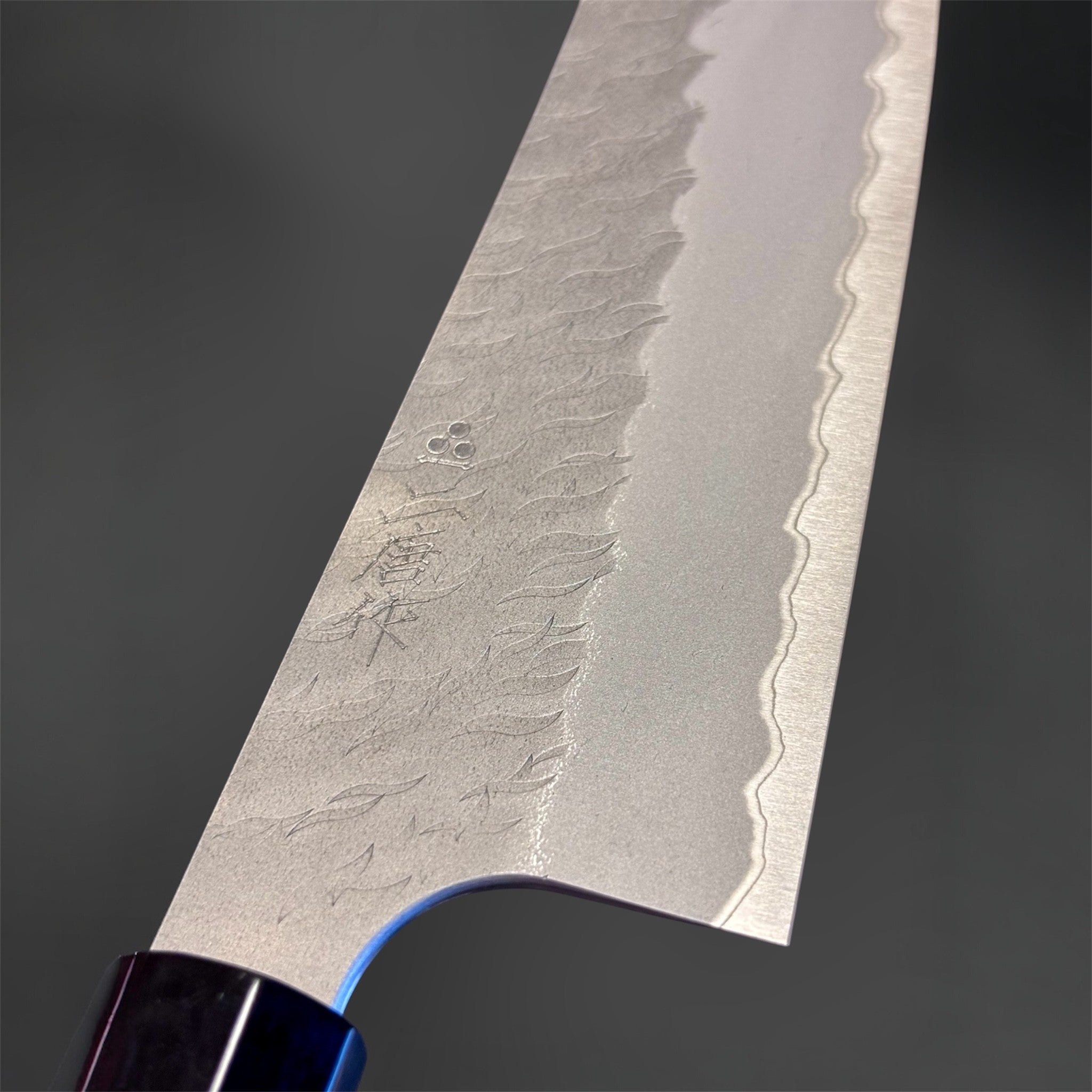Nigara Aogami Super Steel Tsuchime Bunka 180 mm with walnut and horn handle, close-up of tsuchime texture and engraved blade details.