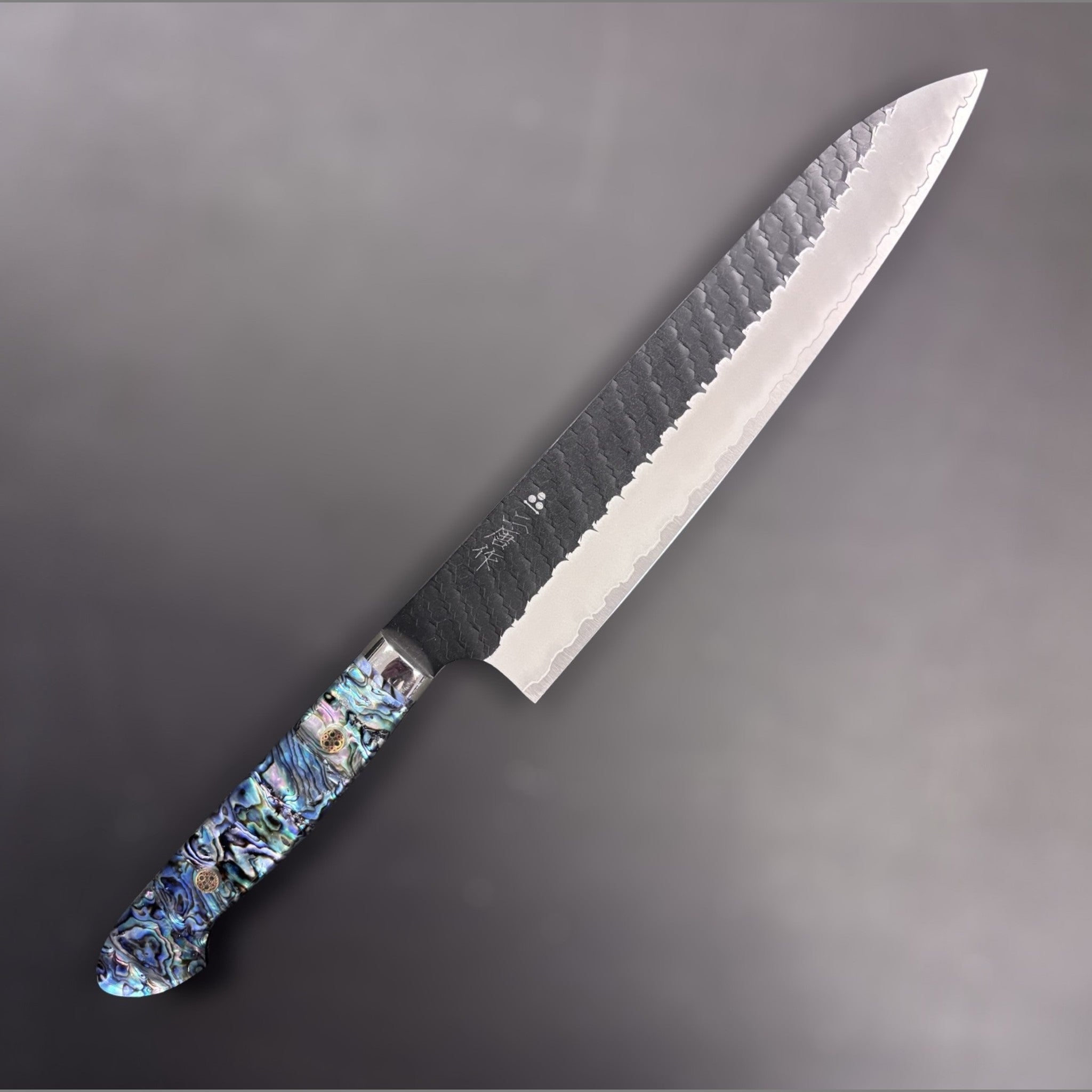 Nigara Hamono SG2 Kurouchi Tsuchime Gyuto 240 mm with abalone Western handle, right-side view.