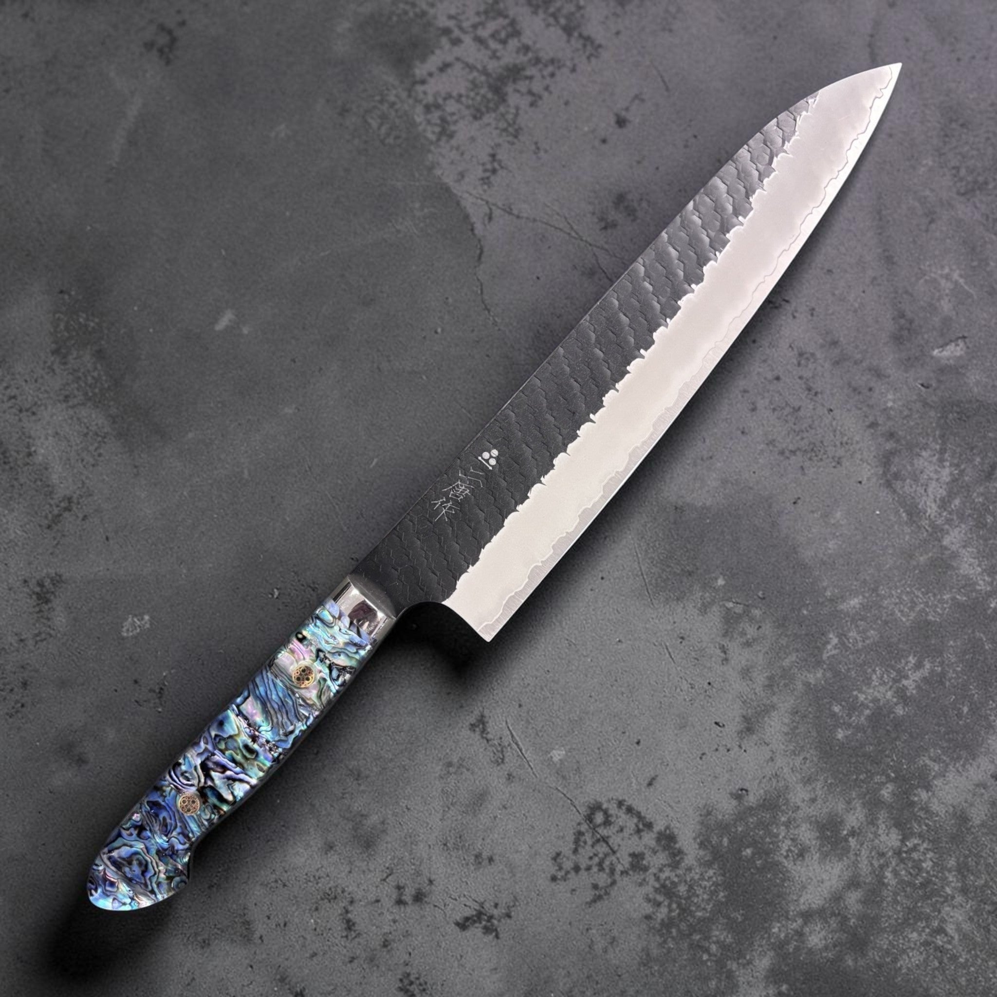 Nigara Hamono SG2 Kurouchi Tsuchime Gyuto 240 mm with abalone Western handle, right-side view.