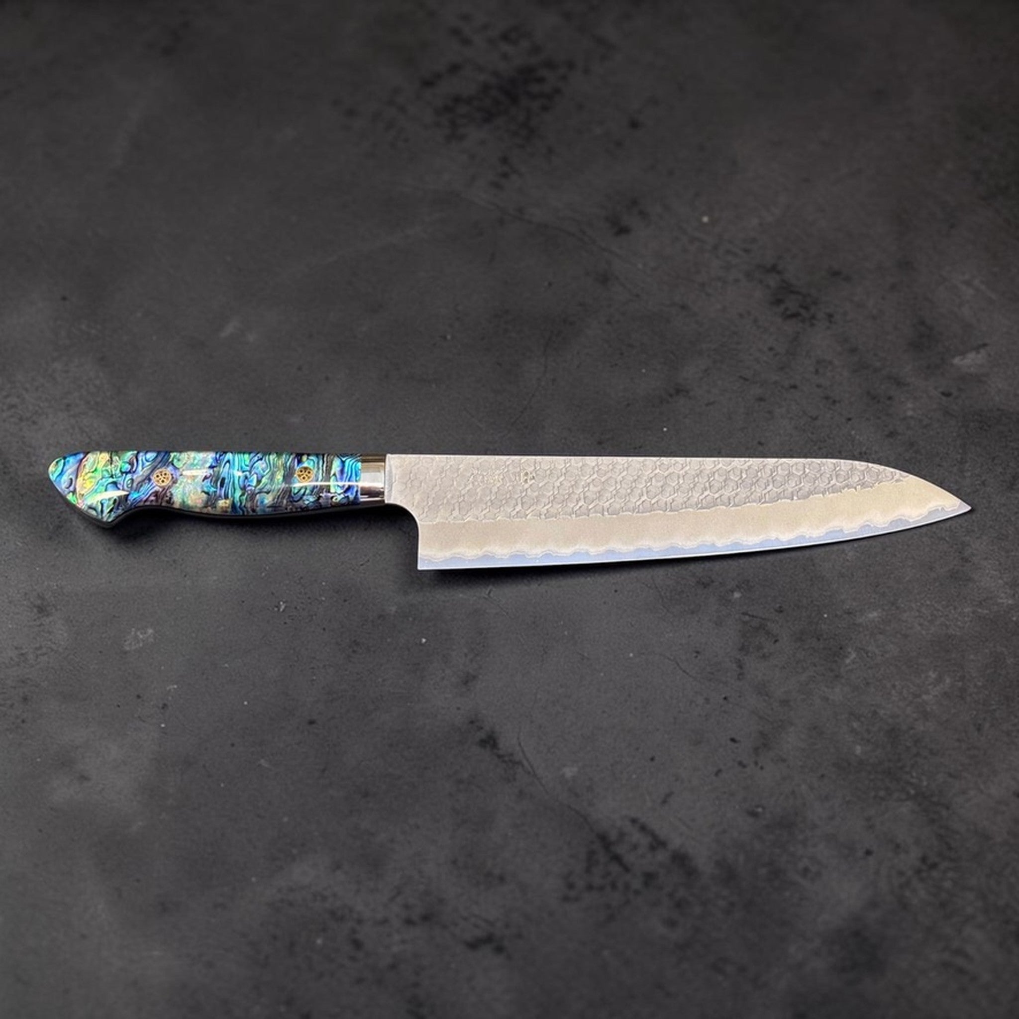 Nigara SG2 Tsuchime Gyuto 240 mm with abalone western handle, full knife right-facing profile showing hammered blade finish.