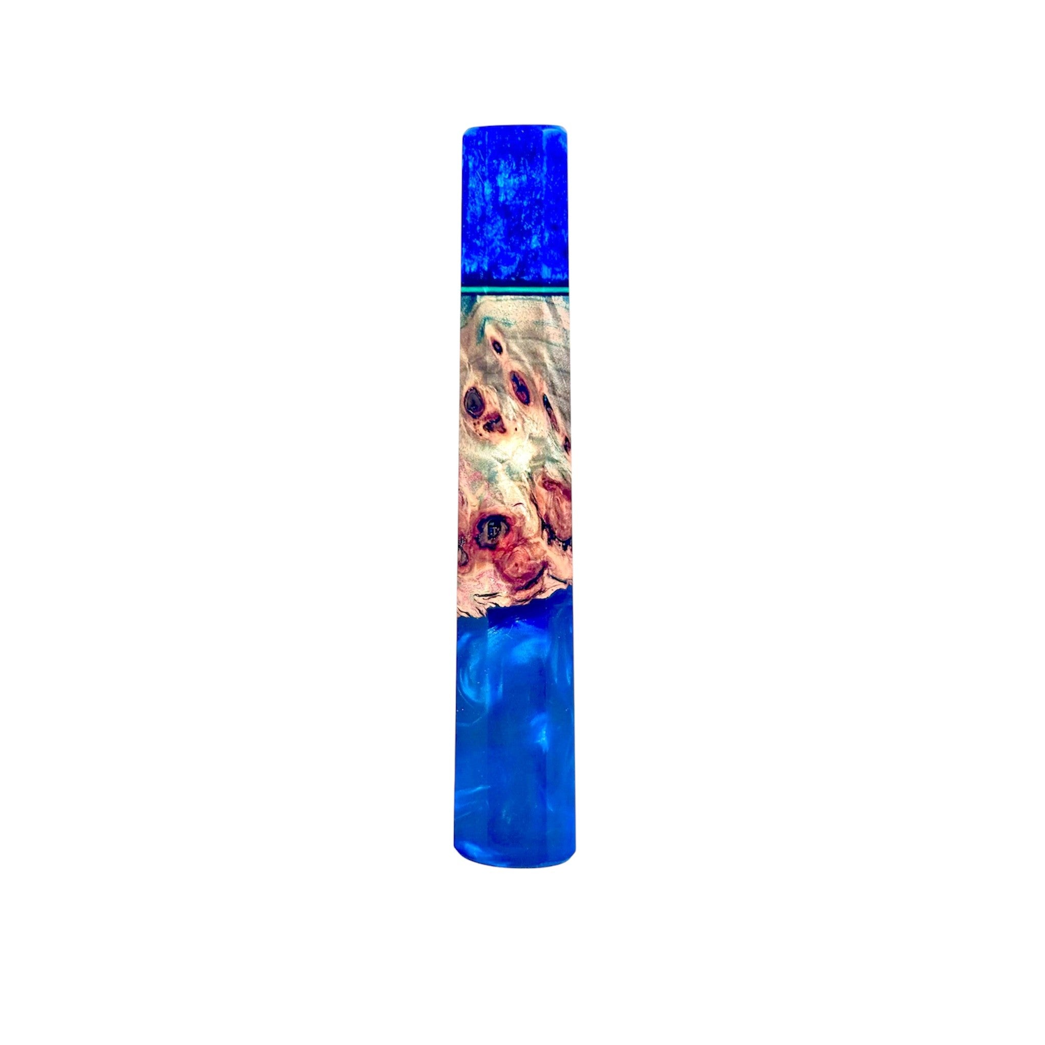 Prisma Knife “Cobalt Forest” custom wa handle—cobalt‑blue pearlescent resin fused with figured burl wood, reverse view, isolated on white.