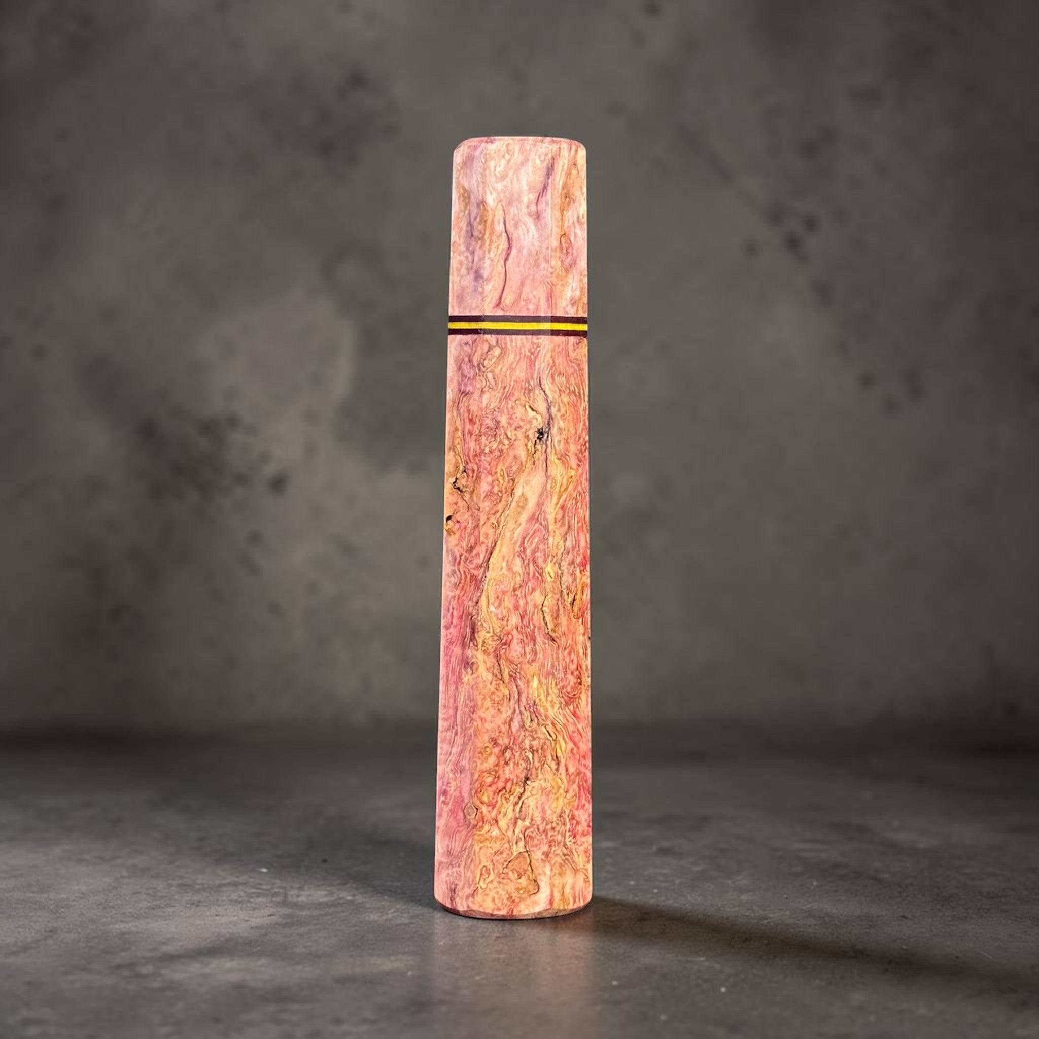 Prisma Knife Handle 1, pink and gold figured wood wa handle with black and yellow accent spacer.