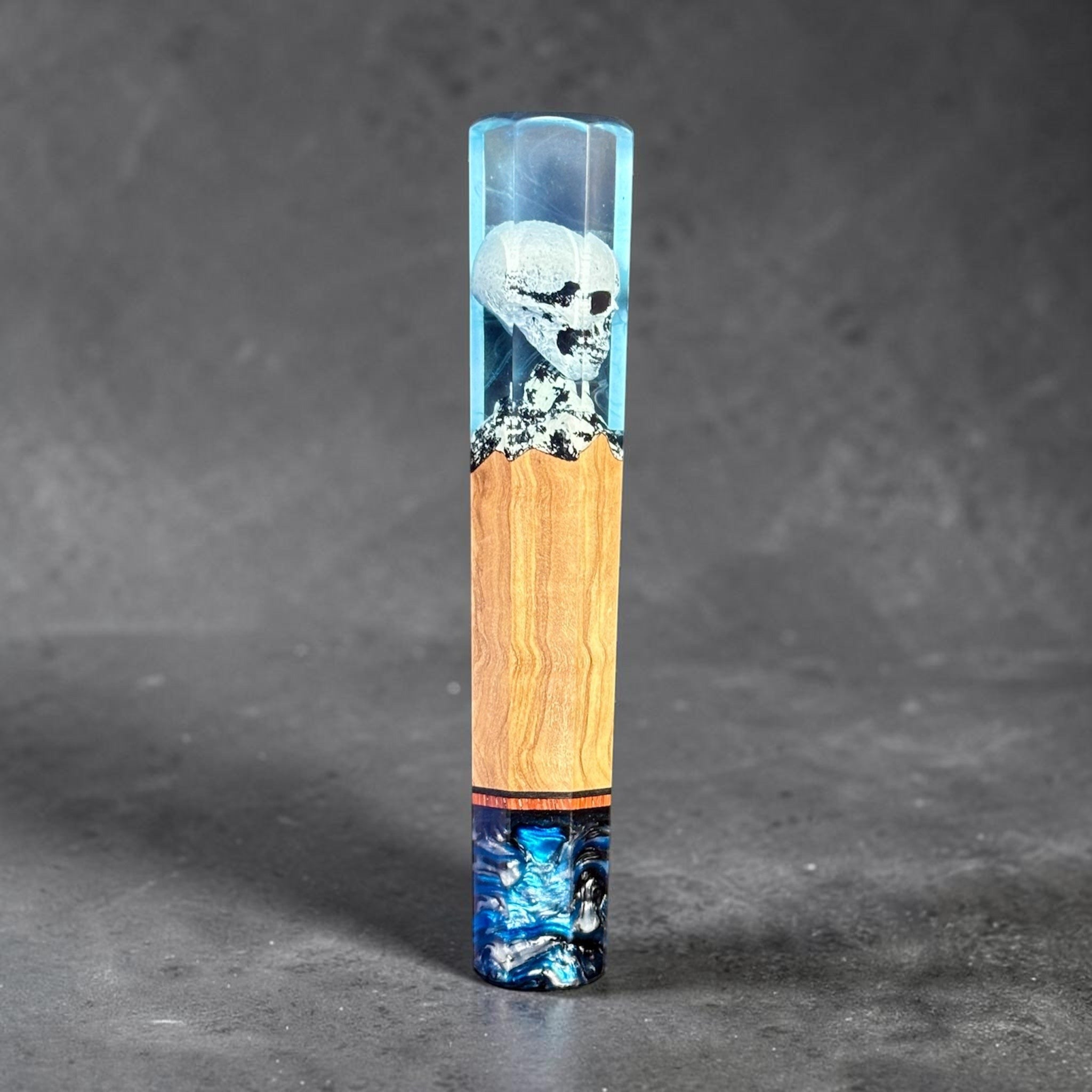 Prisma Knife Handle 2, blue resin and wood wa handle with skull detail and blue-black resin end cap.