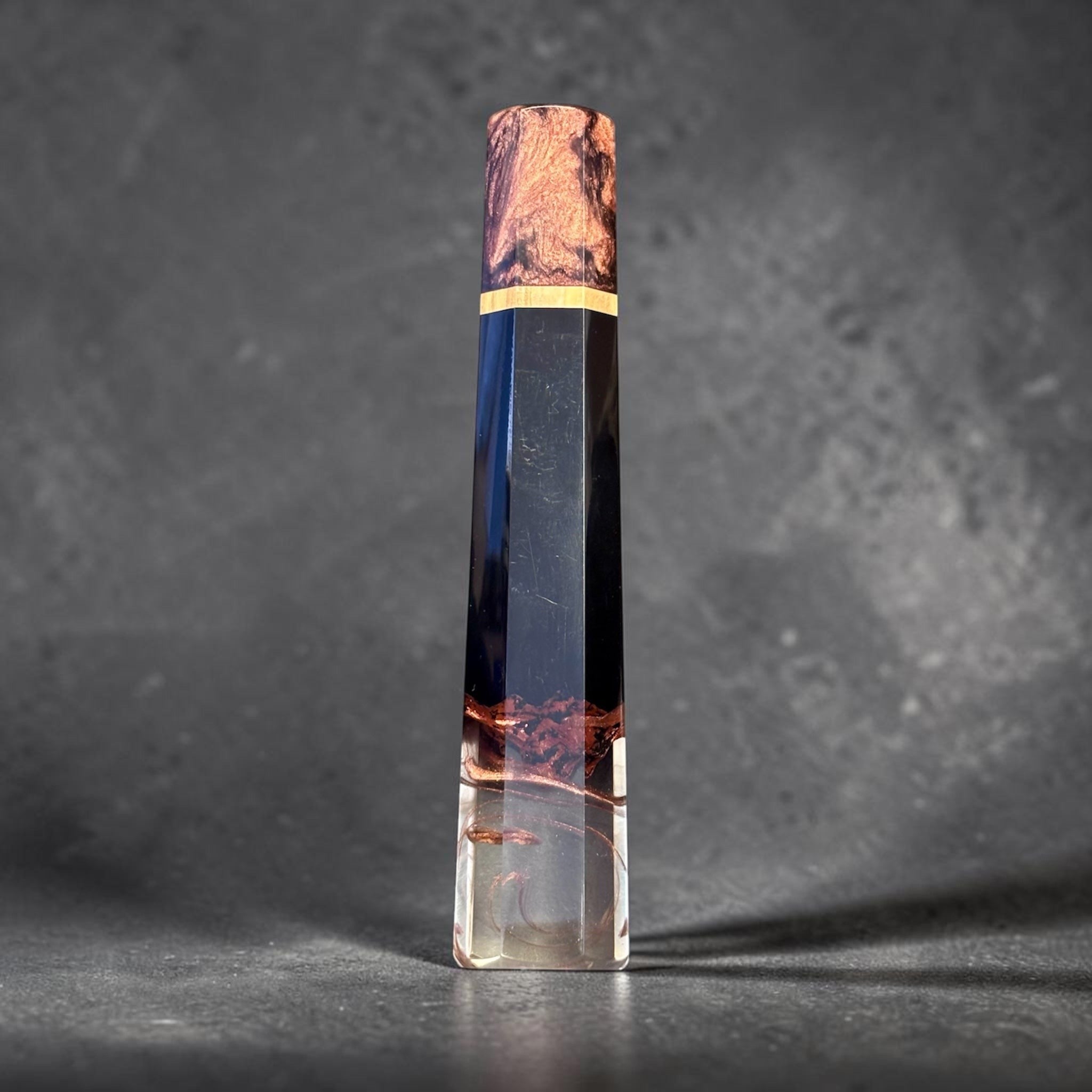 Prisma Knife Handle 8, black resin and copper-toned wood wa handle with clear resin end.