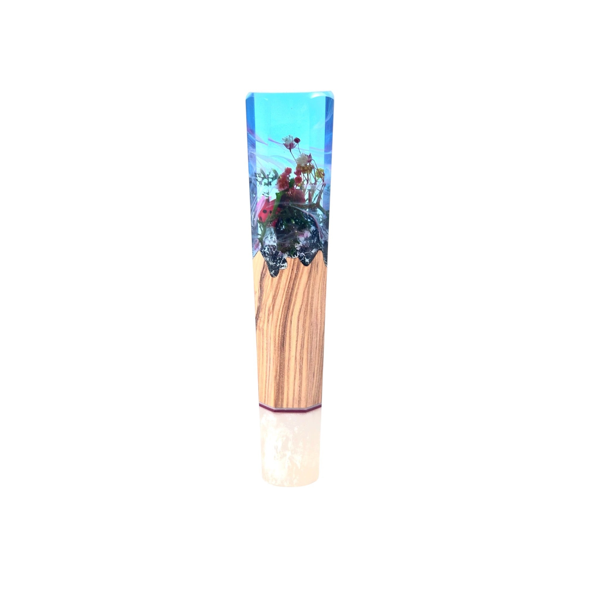Prisma Knife “Ladybug’s Dream” custom wa handle — crystal‑clear sky‑blue resin encapsulating miniature flowers and a red ladybug above olive‑brown wood core, front view, isolated on white.