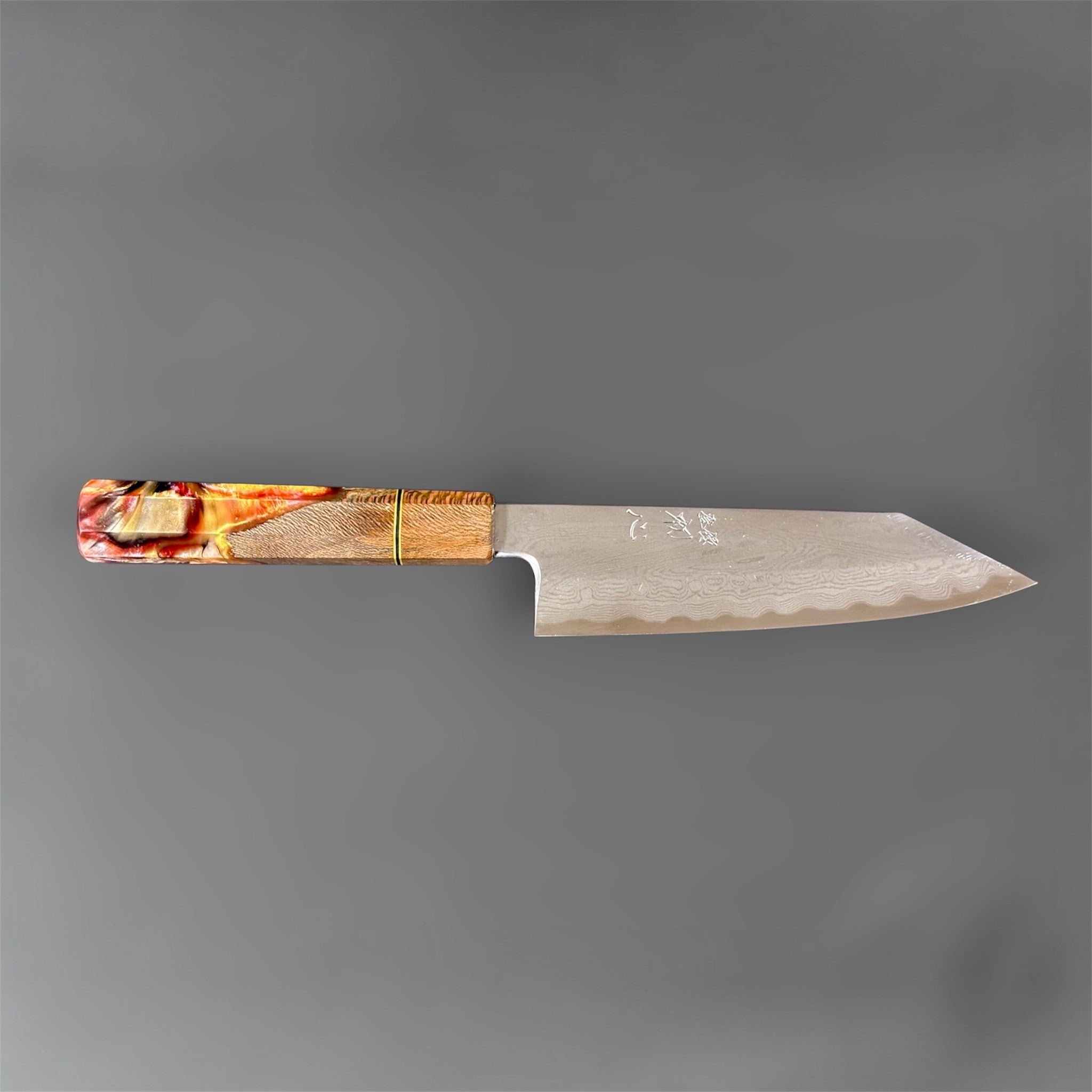 Satoshi Nakagawa Blue #1 Damascus Bunka 180 mm with Prisma Knife handle, side profile showing the bunka blade shape, etched Damascus waves, and handle detail.